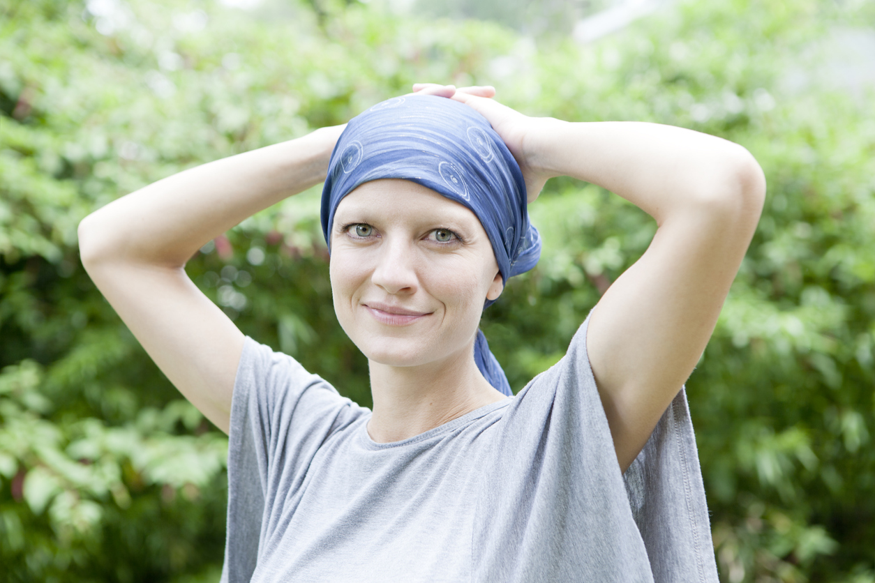 Beautiful young woman with cancer smiling