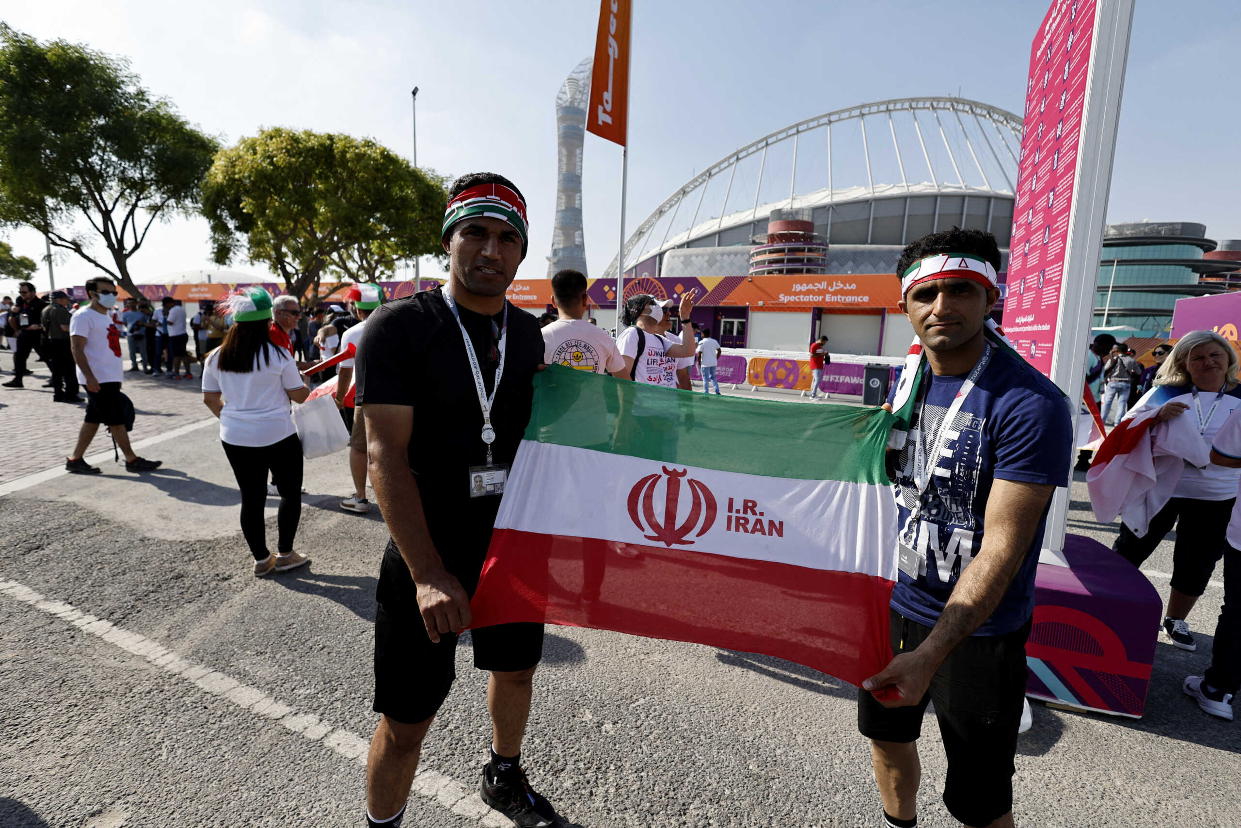 Soccer Football - FIFA World Cup Qatar 2022 - Group B - England v Iran - Khalifa International Stadium, Doha, Qatar - November 21, 2022 Iran fans hold up a flag outside the stadium before the match REUTERS