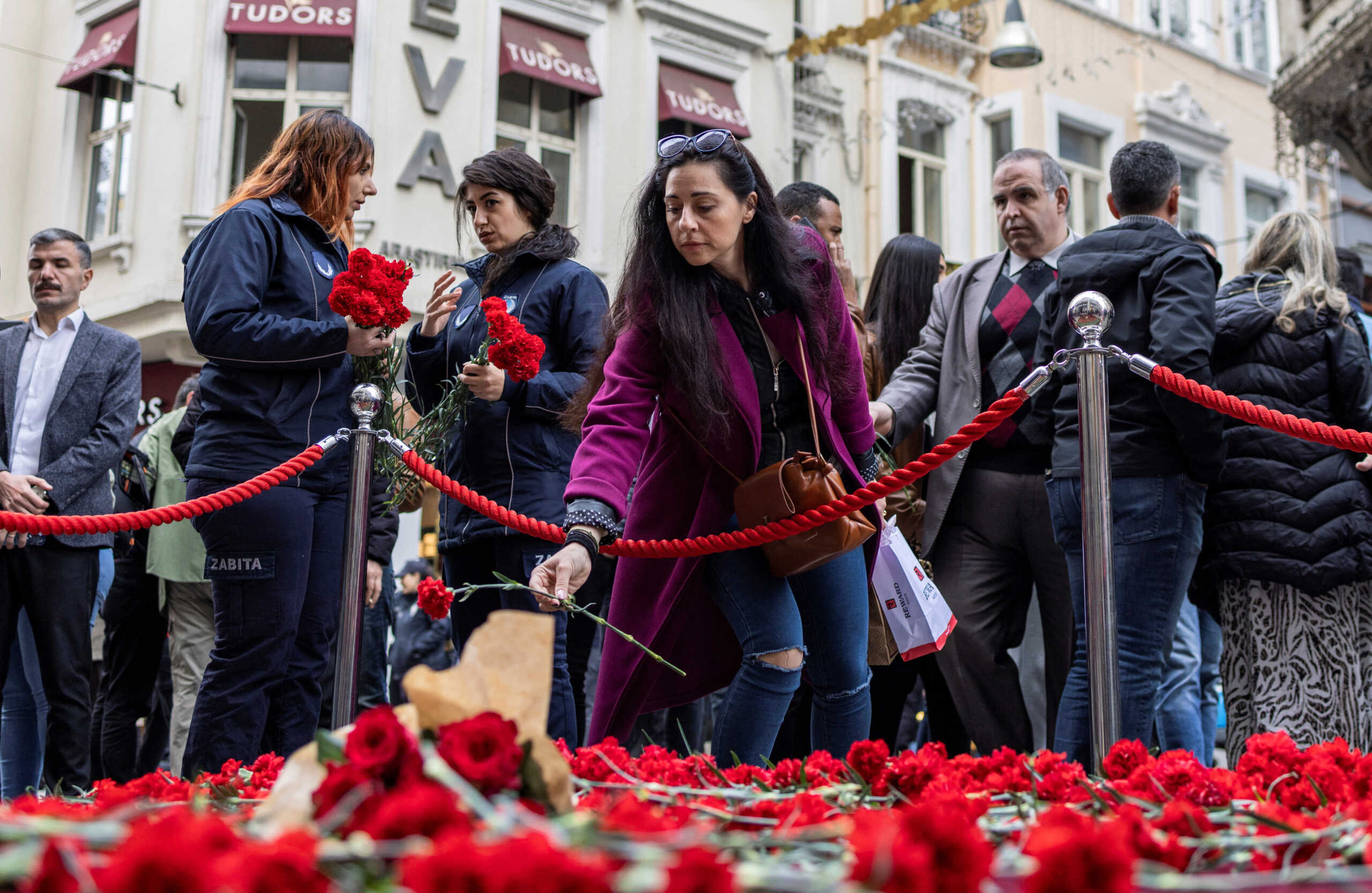 People lay flowers to pay tribute to the victims of a Sunday's blast that took place on Istiklal Avenue, a popular spot for shoppers and tourists, in Istanbul, Turkey, November 14, 2022. REUTERS