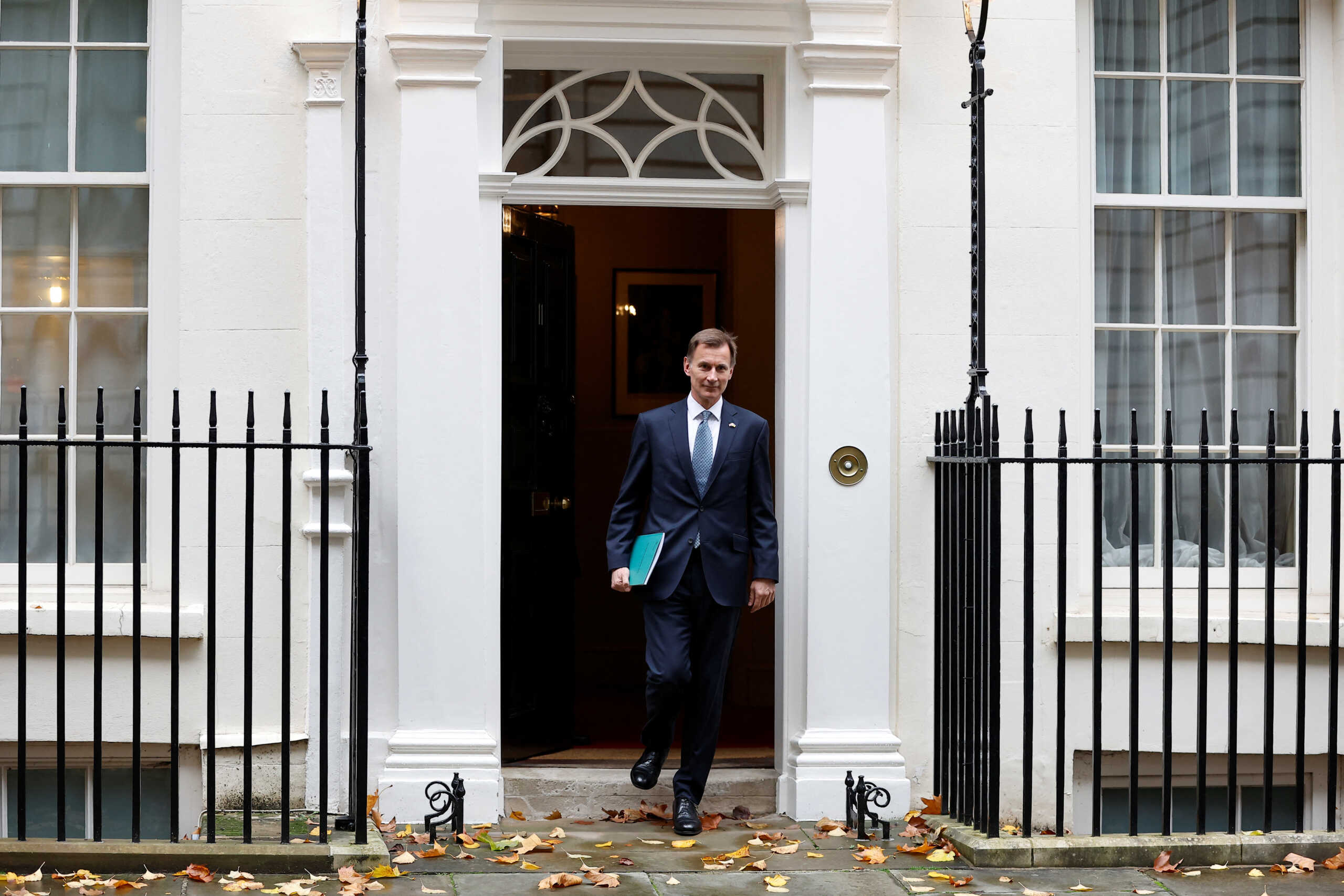 Britain's Chancellor of the Exchequer Jeremy Hunt walks at Downing Street in London, Britain, November 17, 2022. REUTERS