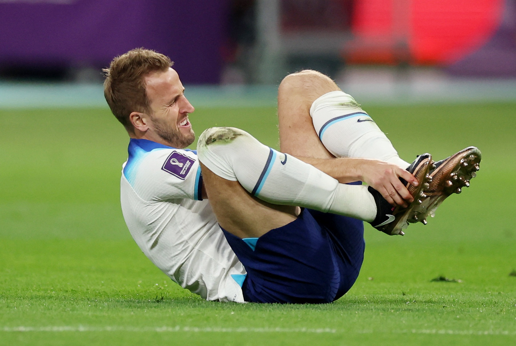 Soccer Football - FIFA World Cup Qatar 2022 - Group B - England v Iran - Khalifa International Stadium, Doha, Qatar - November 21, 2022 England's Harry Kane after sustaining an injury REUTERS