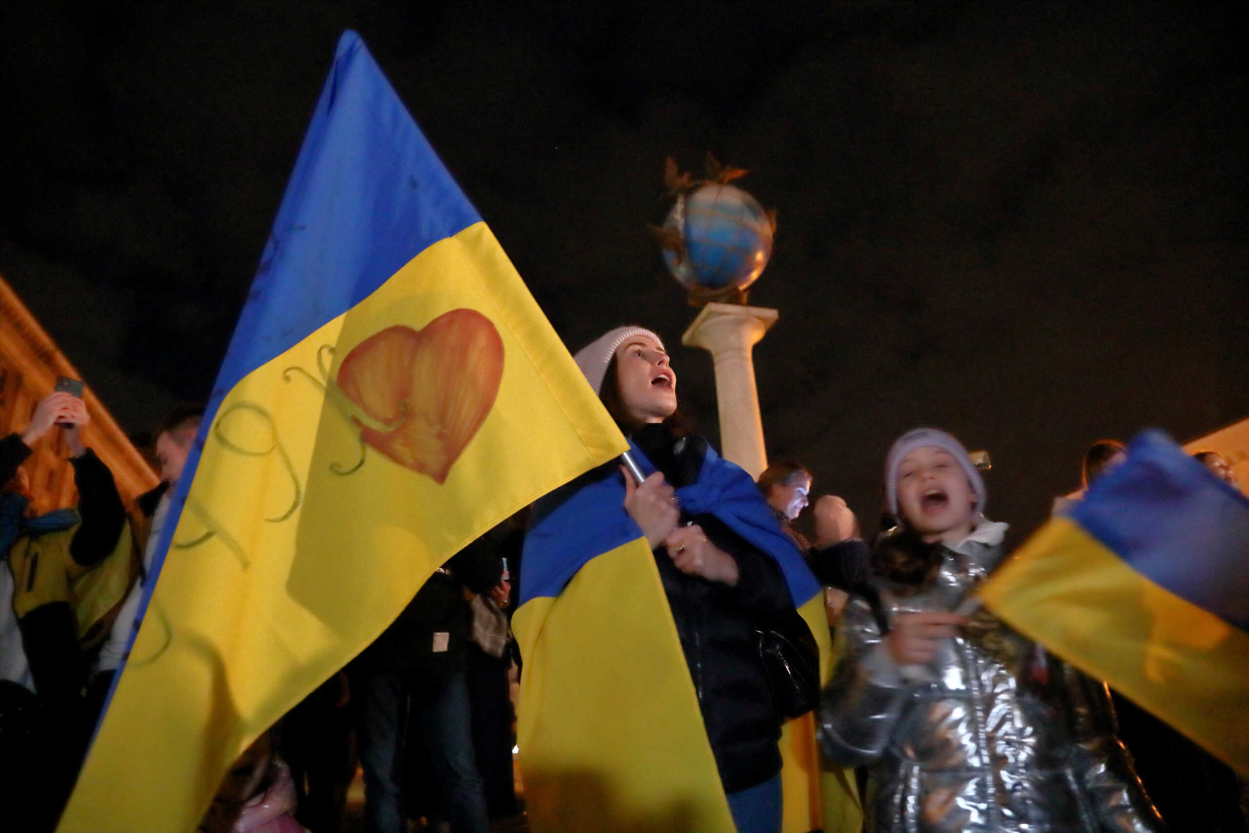 People celebrate after Russia's retreat from Kherson, in central Kyiv, Ukraine November 11, 2022. REUTERS