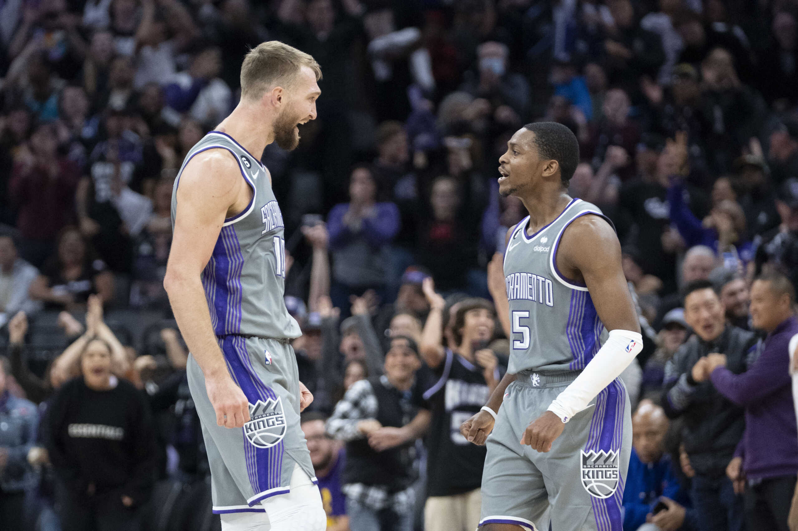 November 20, 2022; Sacramento, California, USA; Sacramento Kings forward Domantas Sabonis (10) celebrates with guard De'Aaron Fox (5) against the Detroit Pistons during the fourth quarter at Golden 1 Center. Mandatory Credit: Kyle Terada-USA TODAY Sports