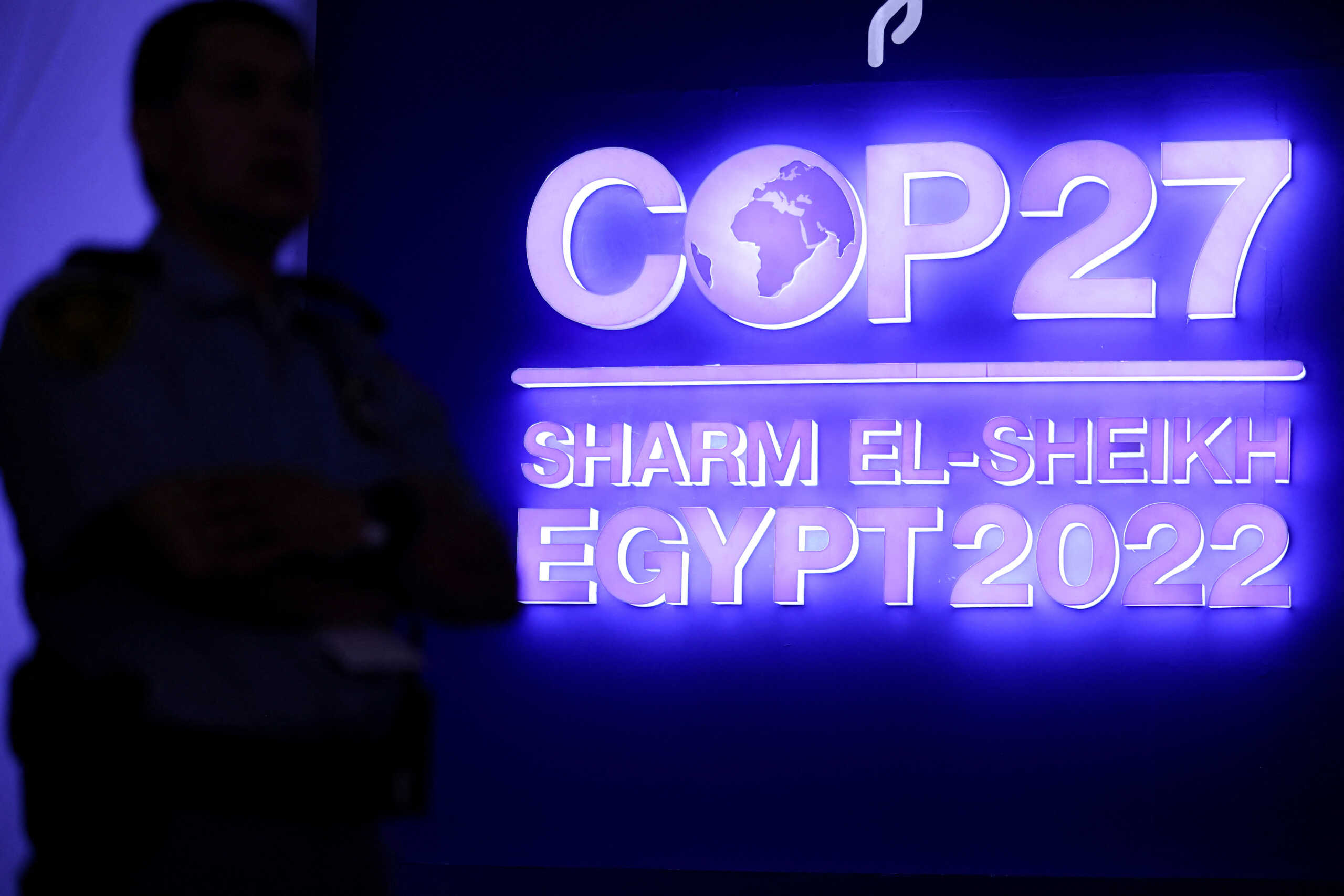 A security personnel stands guard next to the COP27 sign during the closing plenary at the COP27 climate summit in Red Sea resort of Sharm el-Sheikh, Egypt, November 20, 2022. REUTERS