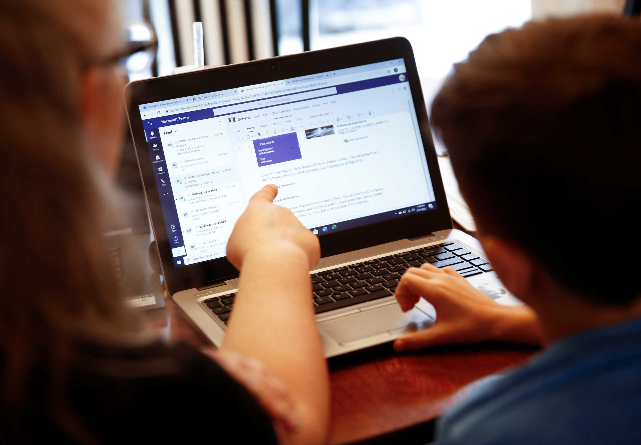 Chrissy Brackett and grandson Caidence Miller, a 4th grader at Cottage Lake Elementary, struggle to navigate the online learning system the Northshore School District will use for two weeks due to coronavirus concerns, at Brackett's home in Woodinville, Washington, U.S. March 11, 2020. Brackett is watching Caidence while his mother works at a preschool during the day.  REUTERS