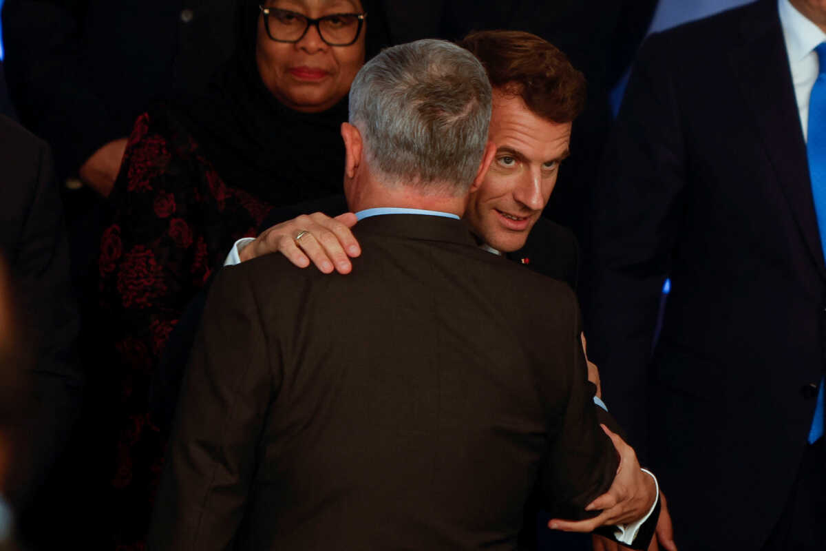 France's President Emmanuel Macron greets Jordan's King Abdullah II as they attend the COP27 climate summit in Sharm el-Sheikh, Egypt November 7, 2022. REUTERS