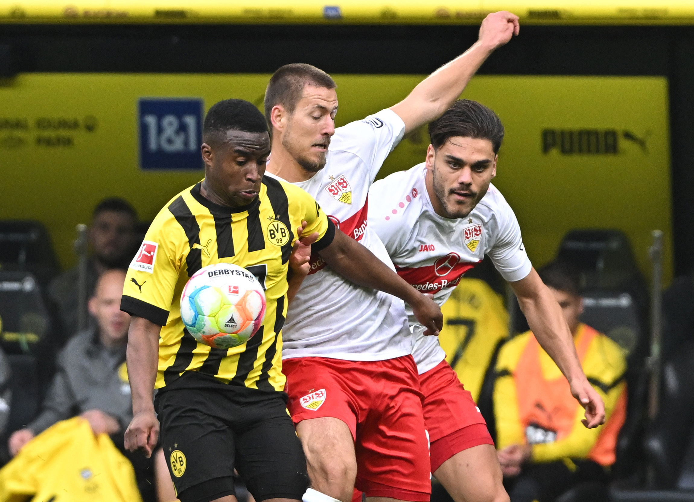 Soccer Football - Bundesliga - Borussia Dortmund v VfB Stuttgart - Signal Iduna Park, Dortmund, Germany - October 22, 2022 Borussia Dortmund's Youssoufa Moukoko in action with VfB Stuttgart's Waldemar Anton and Konstantinos Mavropanos REUTERS