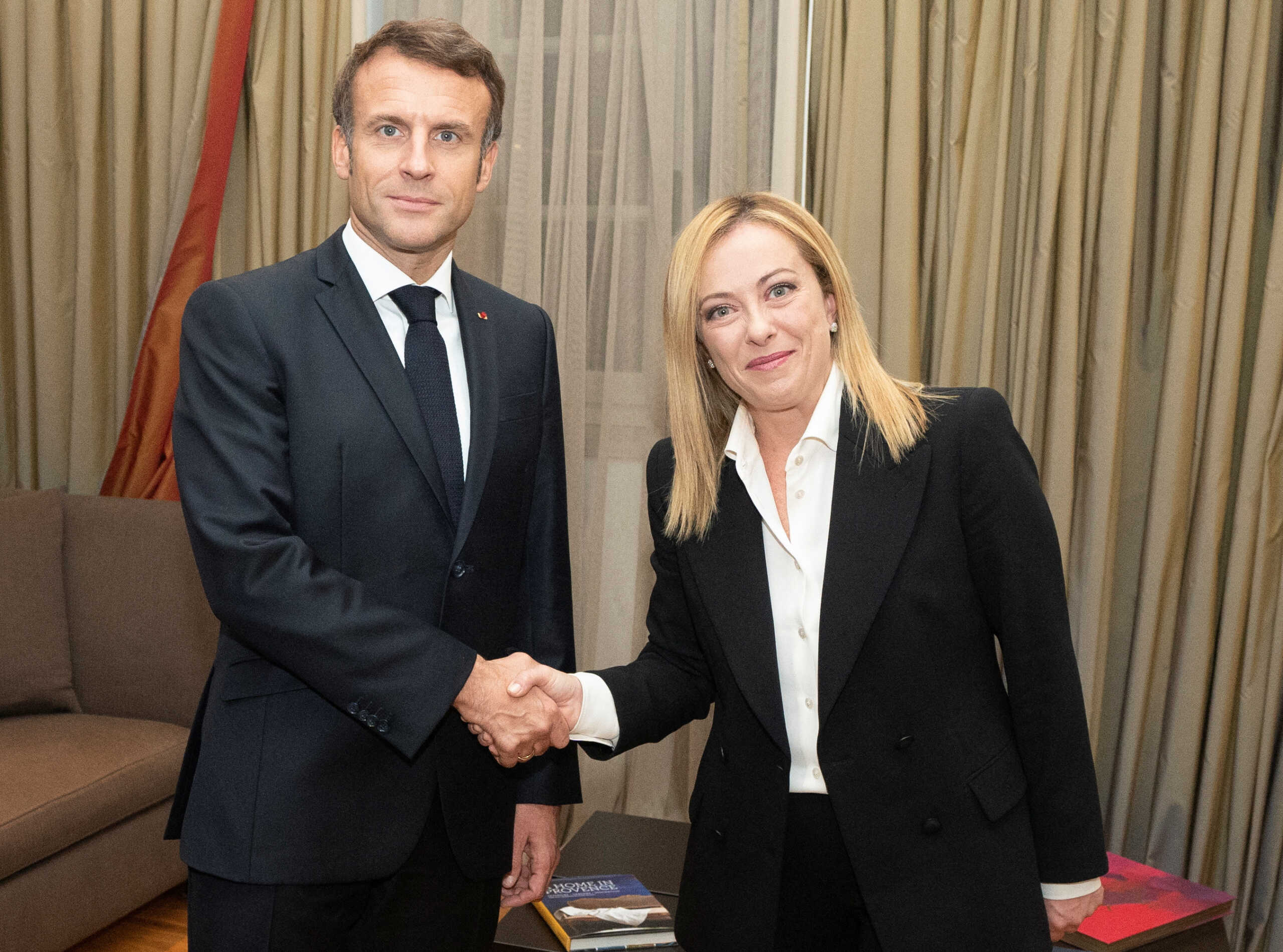 Italian Prime Minister Giorgia Meloni shakes hands with French President Emmanuel Macron during a meeting in Rome, Italy, October 23, 2022. Filippo Attili