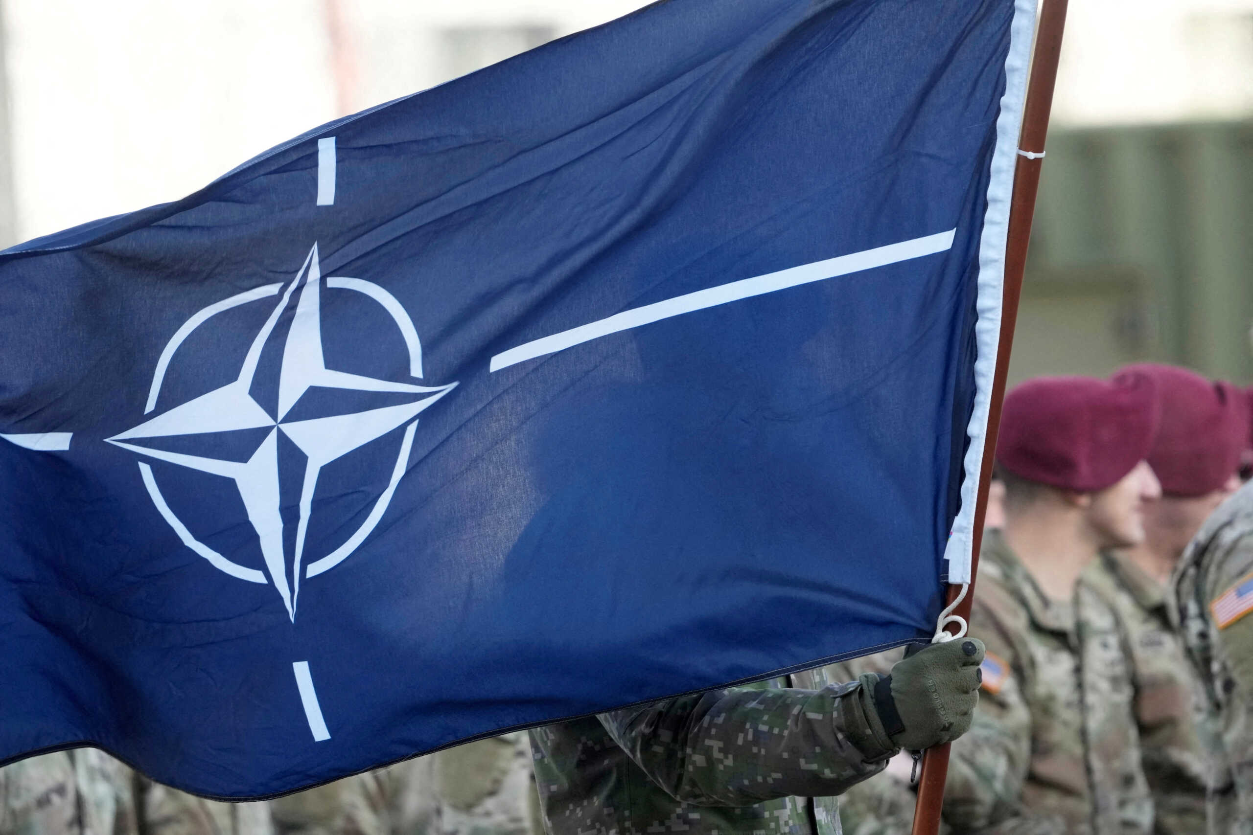 FILE PHOTO: NATO flag flutters during U.S. troops arrival ceremony in Adazi military base, Latvia February 25, 2022. REUTERS