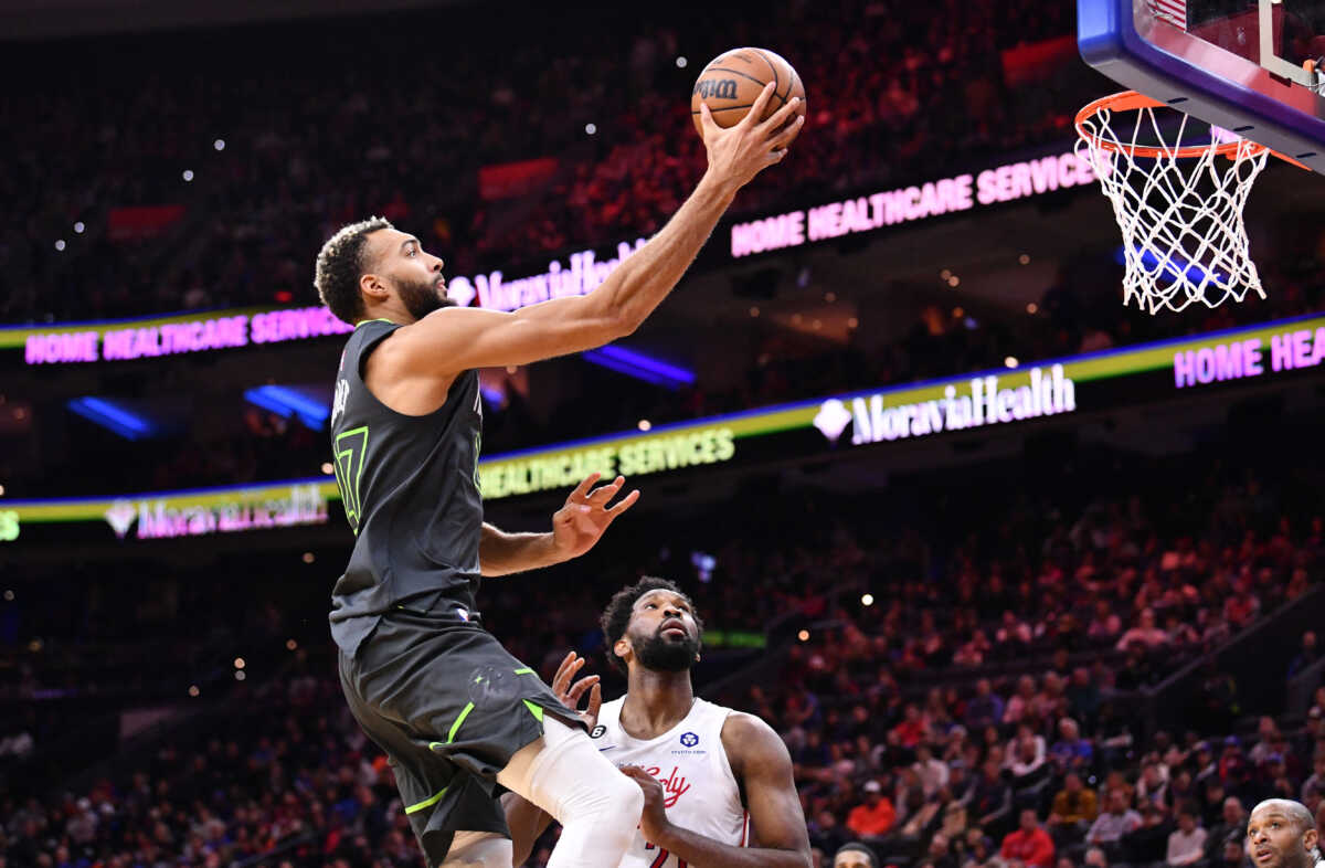 Nov 19, 2022; Philadelphia, Pennsylvania, USA; Minnesota Timberwolves center Rudy Gobert (27) shoots over Philadelphia 76ers center Joel Embiid (21) in the second quarter at Wells Fargo Center. Mandatory Credit: Kyle Ross-USA TODAY Sports