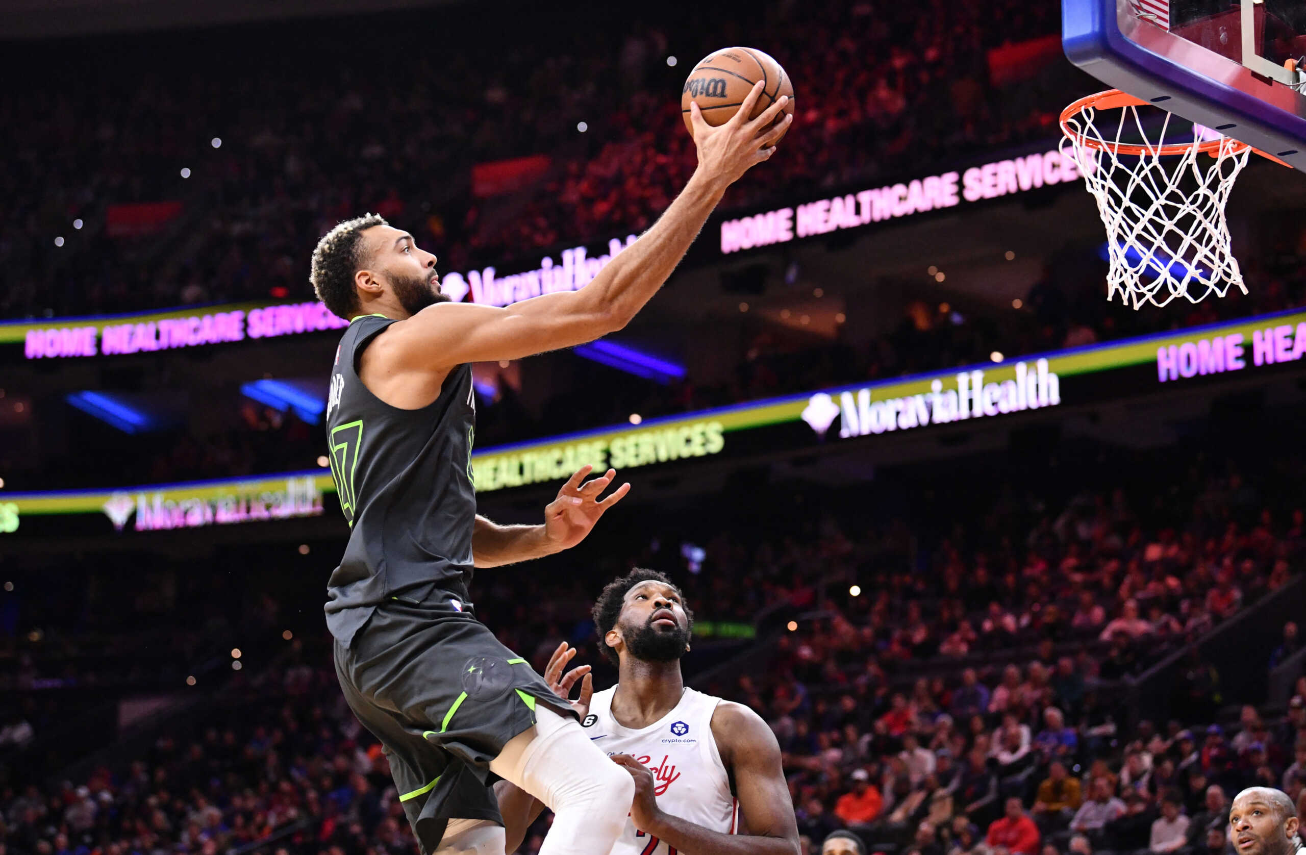 Nov 19, 2022; Philadelphia, Pennsylvania, USA; Minnesota Timberwolves center Rudy Gobert (27) shoots over Philadelphia 76ers center Joel Embiid (21) in the second quarter at Wells Fargo Center. Mandatory Credit: Kyle Ross-USA TODAY Sports