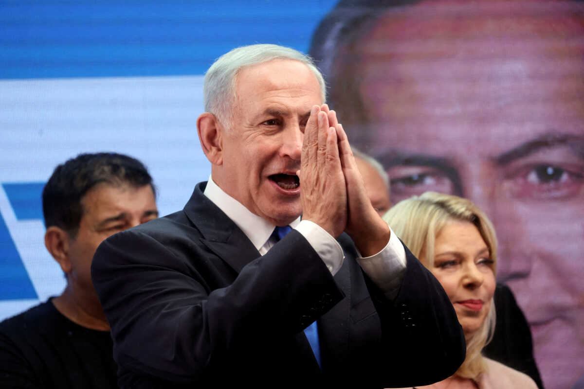 FILE PHOTO: Former Israeli Prime Minister Benjamin Netanyahu gestures as he addresses his supporters from a truck at a campaign event in the run up to Israel's election in Or Yehuda, Israel October 30, 2022. REUTERS