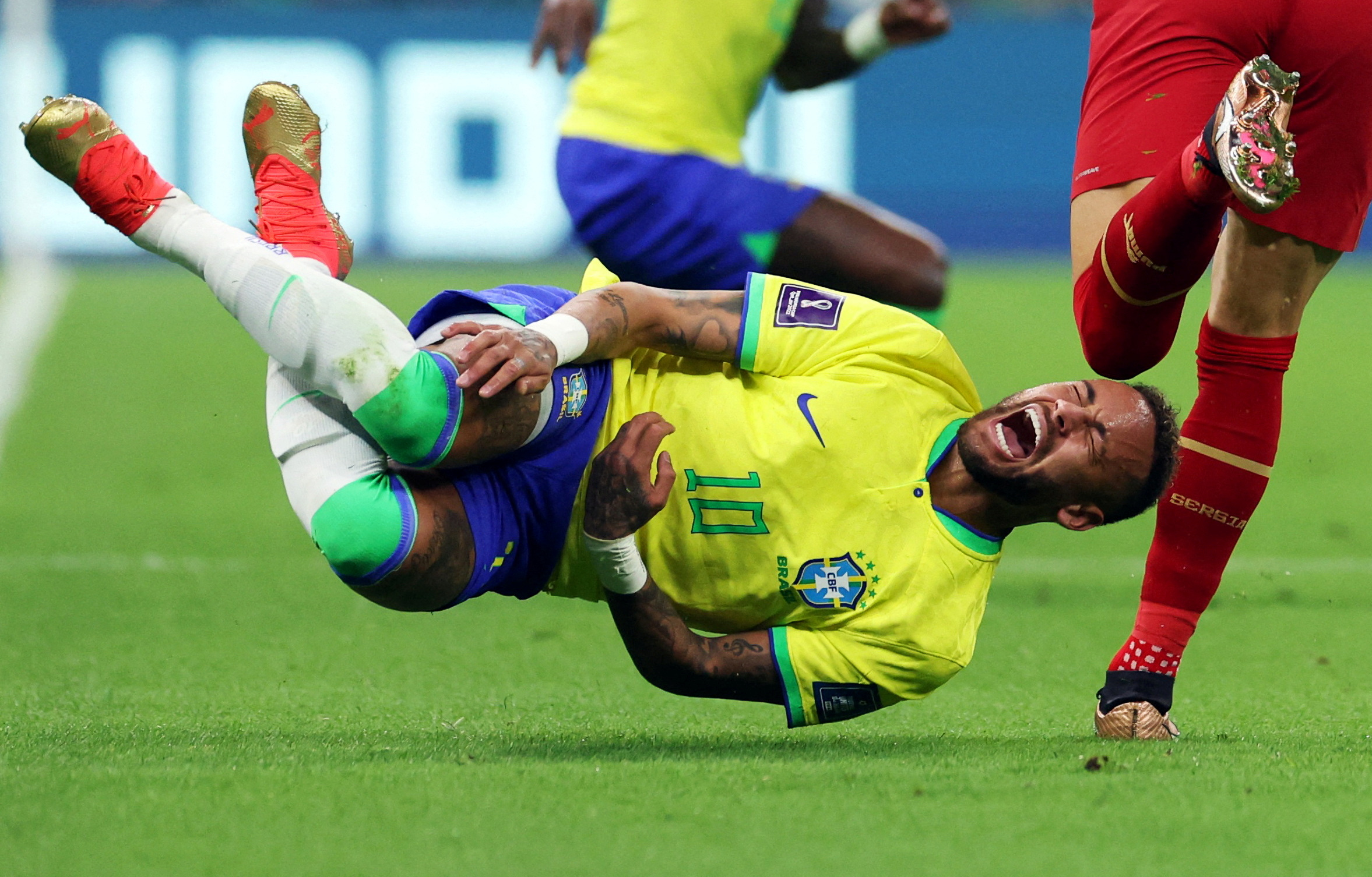 Soccer Football - FIFA World Cup Qatar 2022 - Group G - Brazil v Serbia - Lusail Stadium, Lusail, Qatar - November 24, 2022 Brazil's Neymar reacts after a challenge from Serbia'a Sasa Lukic REUTERS