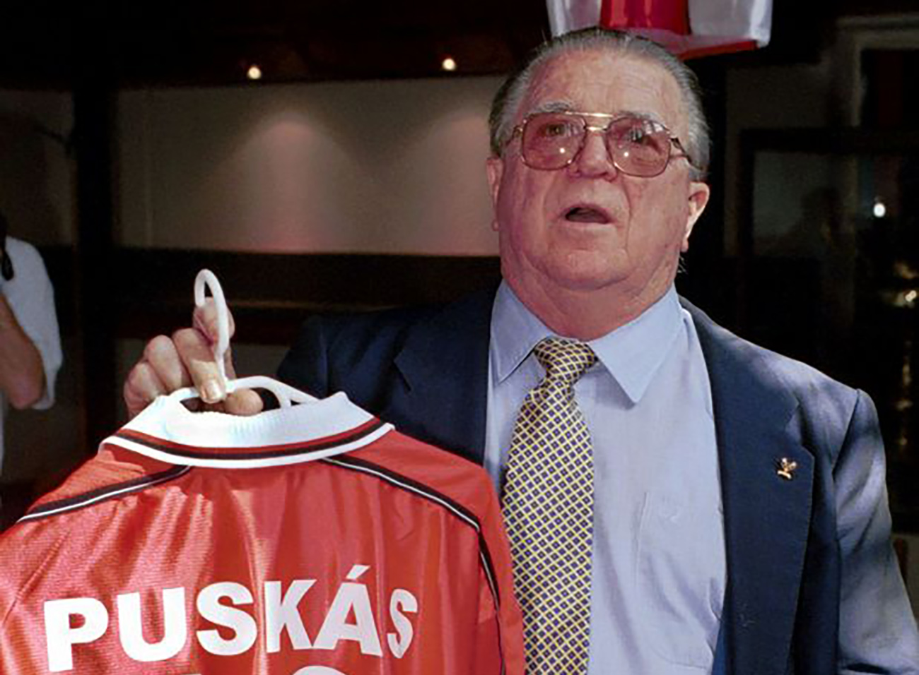 BUD01-20000721-BUDAPEST,HUNGARY: Legendary Hungarian soccer player of the 50's and 60's Ferenc Puskas, now 72, shows off the new team kit of his former club Kispest-Honved at the Bozsik stadium Thursday 20th July when they presented him with his own No 10 shirt.  The club never use the number 10 shirt in their first division games.   EPA PHOTO
