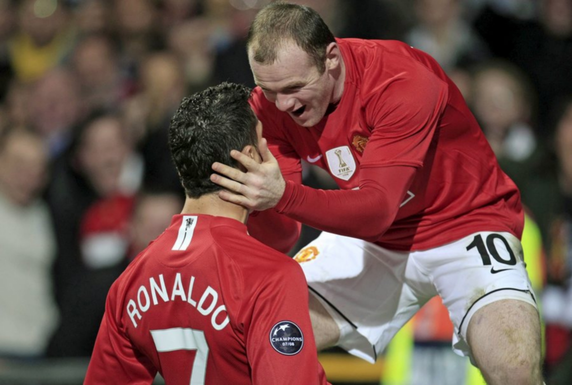 epa01662444 Christiano Ronaldo (L) celebrates with Manchester United teammate Wayne Rooney (R) after scoring his teams second goal during the UEFA Champions League round of sixteen soccer match at Old Trafford in Manchester, Britain, 11 March 2009.  EPA
NO ONLINE