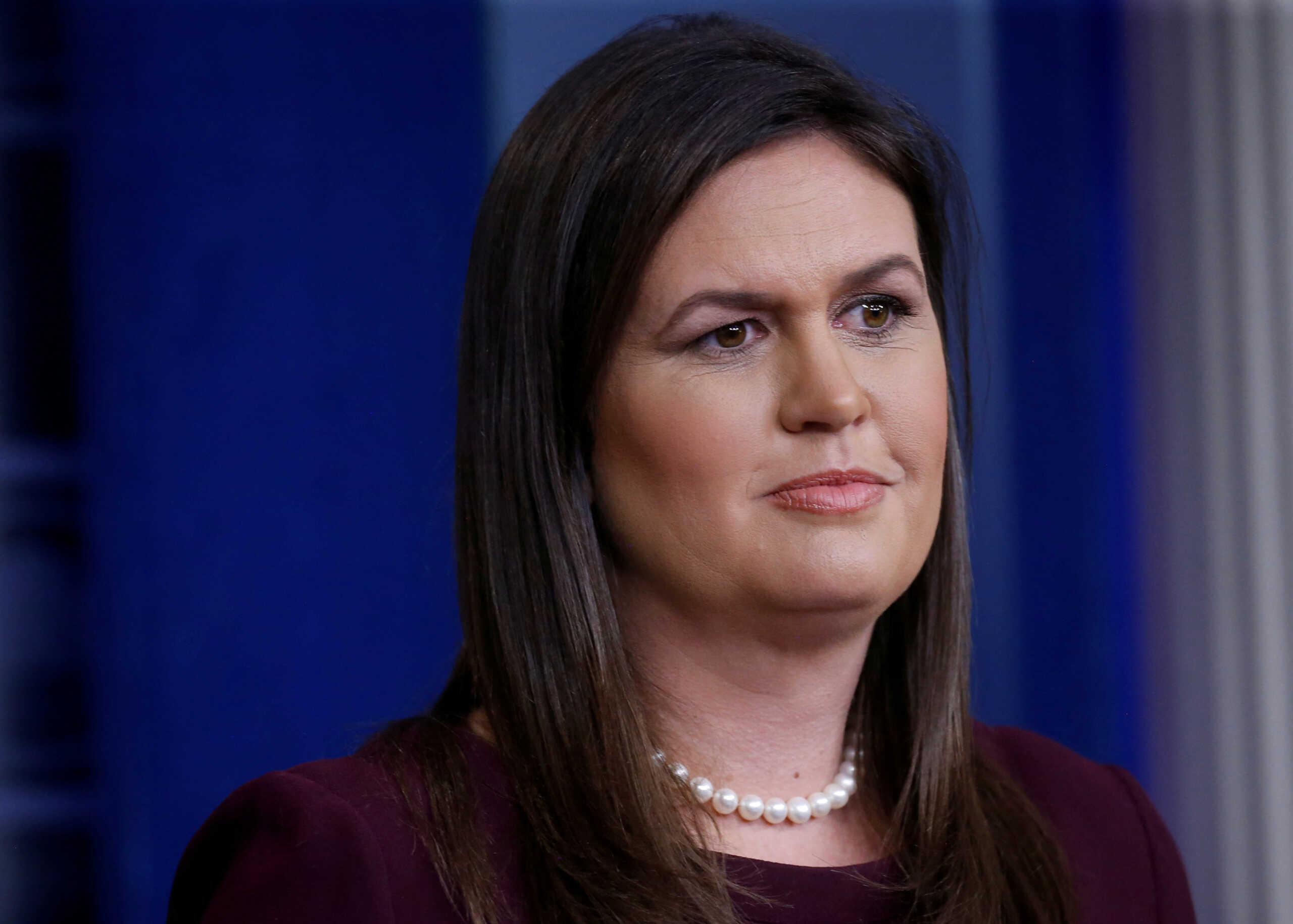 FILE PHOTO: Republican candidate for Governor of Arkansas, running in the 2022 U.S. midterm elections, Sarah Huckabee Sanders, former White House Press Secretary, answers reporters questions about Judge Brett Kavanaugh's Supreme Court nomination during a news conference in the White House briefing room in Washington, U.S., October 3, 2018. REUTERS