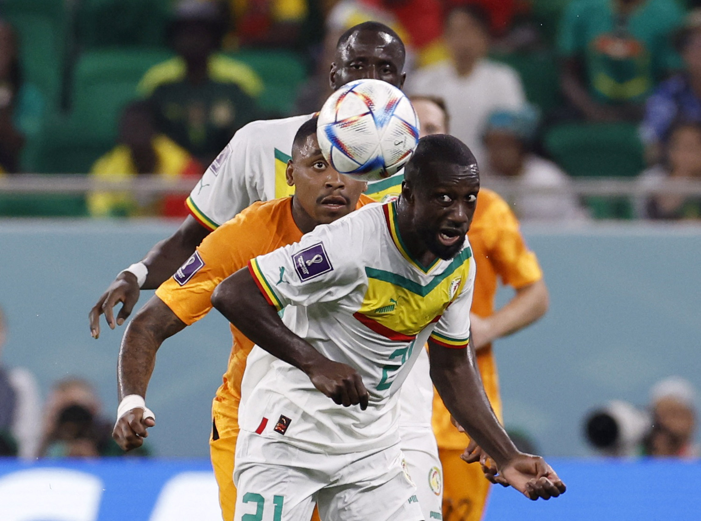Soccer Football - FIFA World Cup Qatar 2022 - Group A - Senegal v Netherlands - Al Thumama Stadium, Doha, Qatar - November 21, 2022 Senegal's Youssouf Sabaly in action with Netherlands' Steven Bergwijn REUTERS
