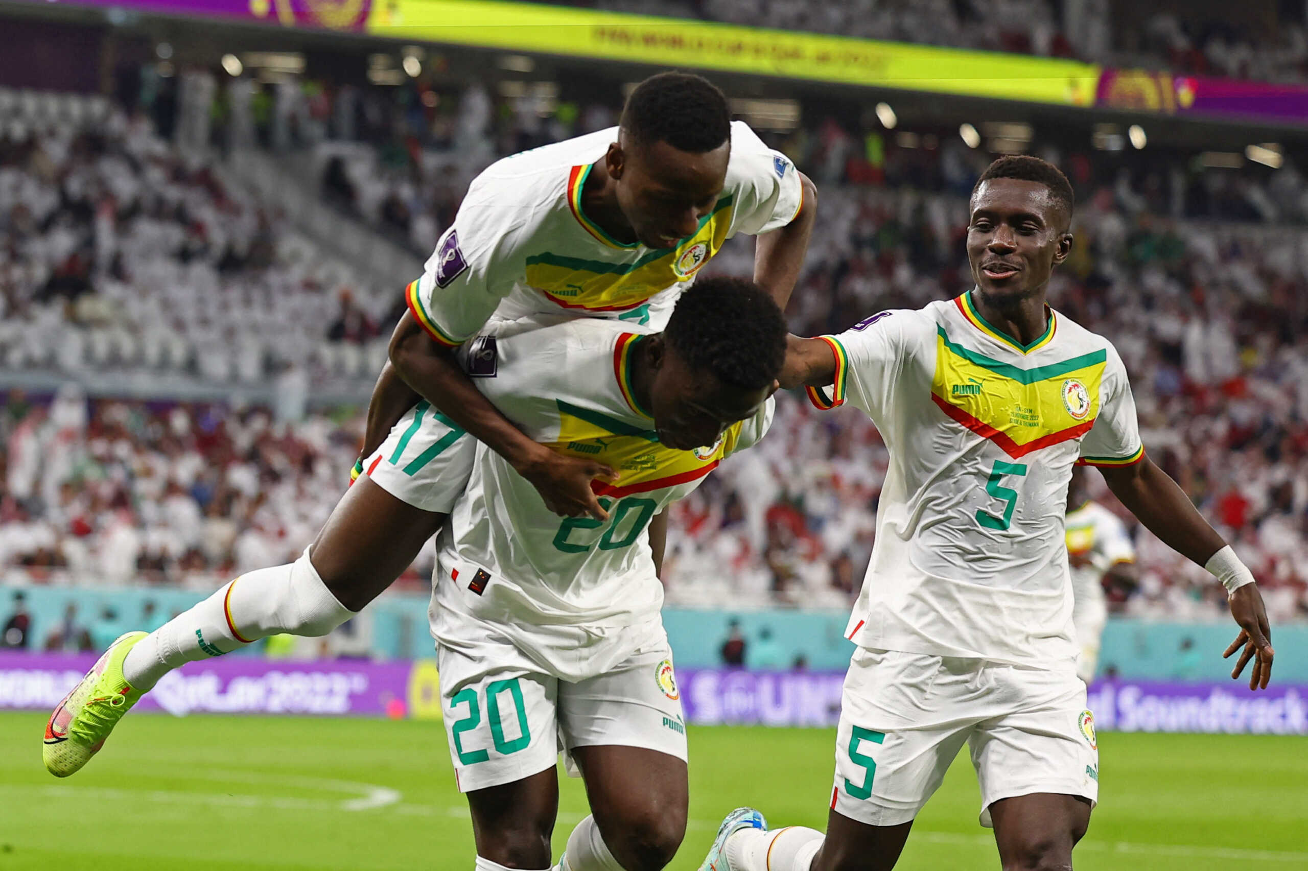Soccer Football - FIFA World Cup Qatar 2022 - Group A - Qatar v Senegal - Al Thumama Stadium, Doha, Qatar - November 25, 2022  Senegal's Bamba Dieng celebrates scoring their third goal with teammates REUTERS