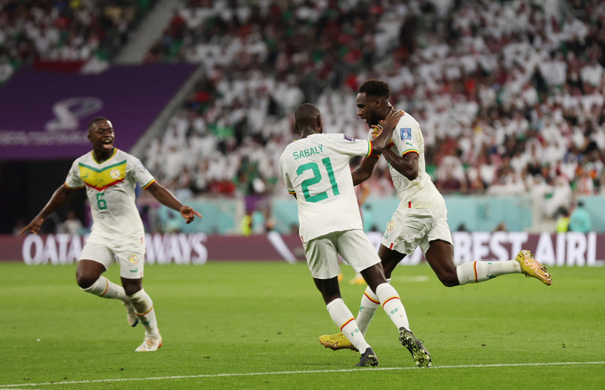 Soccer Football - FIFA World Cup Qatar 2022 - Group A - Qatar v Senegal - Al Thumama Stadium, Doha, Qatar - November 25, 2022  Senegal's Boulaye Dia celebrates scoring their first goal with Youssouf Sabaly and Nampalys Mendy REUTERS