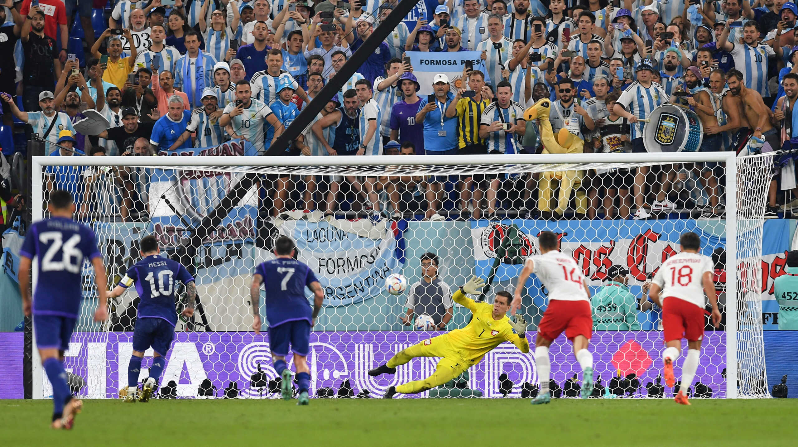 Soccer Football - FIFA World Cup Qatar 2022 - Group C - Poland v Argentina - Stadium 974, Doha, Qatar - November 30, 2022 Poland's Wojciech Szczesny saves a penalty from Argentina's Lionel Messi REUTERS