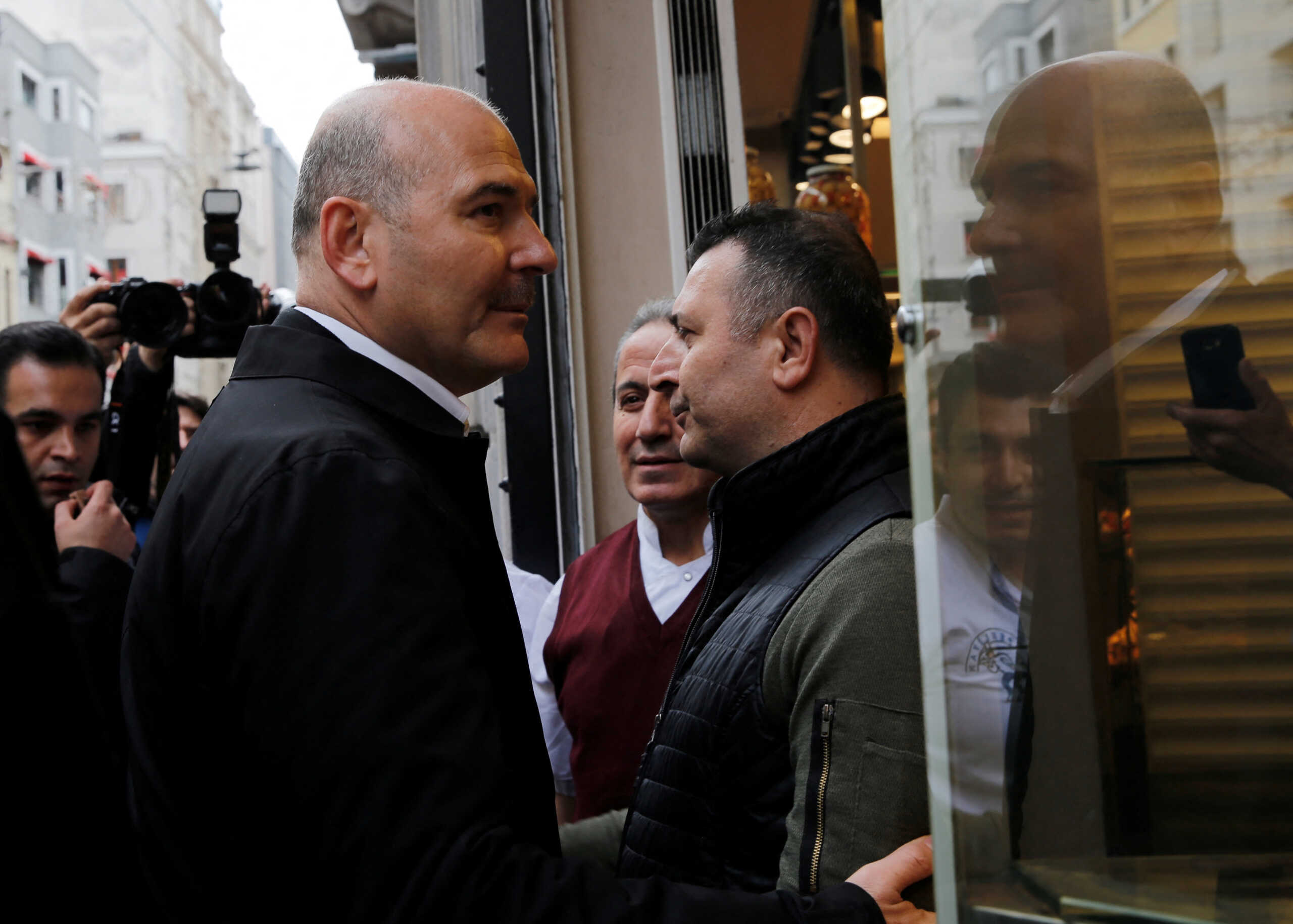 Interior Minister Suleyman Soylu talks to shop owners as he visits a blast site on Istiklal Avenue, a popular spot for shoppers and tourists, in Istanbul, Turkey, November 14, 2022. REUTERS