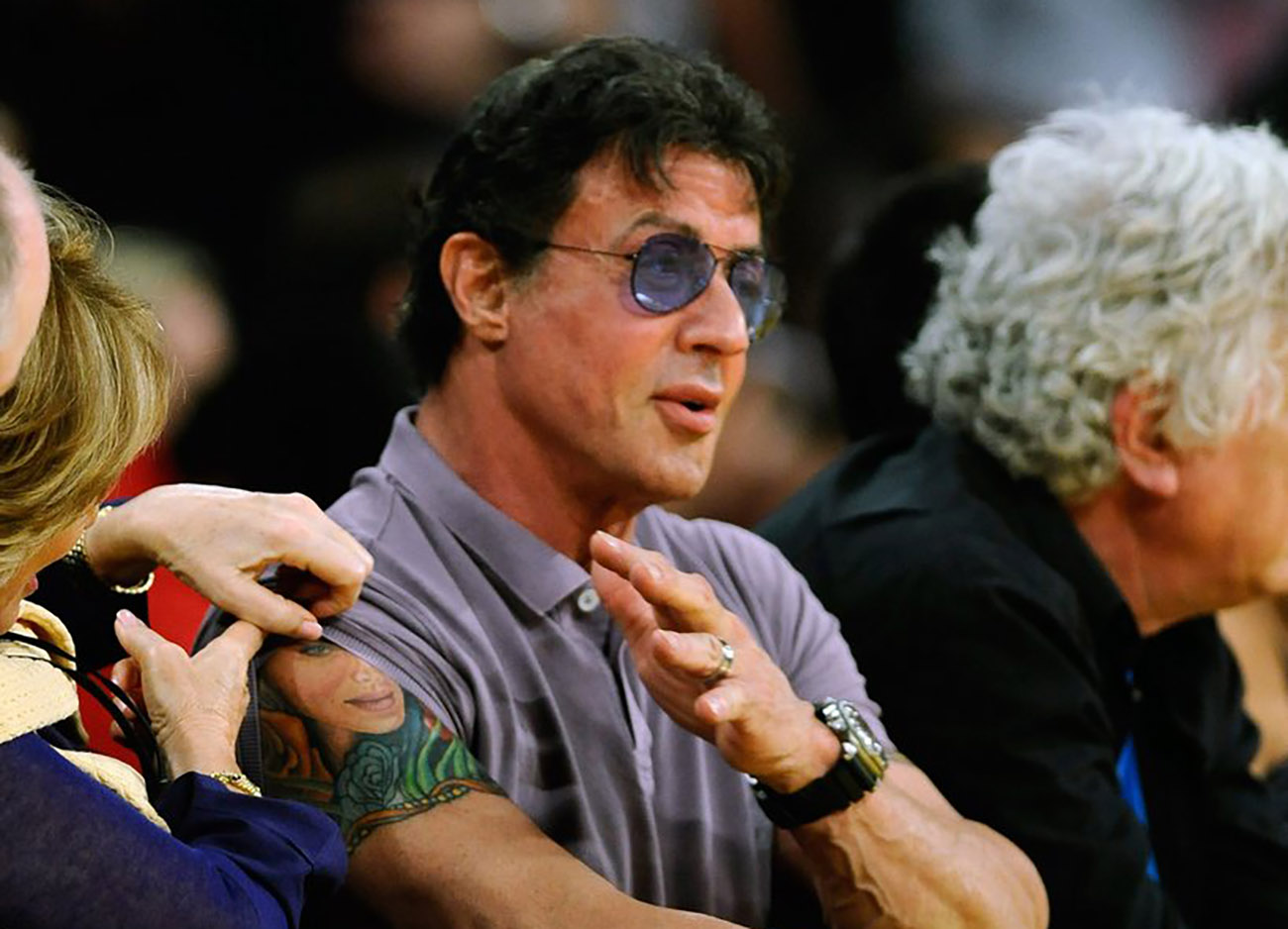 epa02190048 Actor Sylvester Stalone shows a tatoo while watching the Boston Celtics defeat the Los Angeles Lakers 103-94 in Game Two of the NBA Finals at the Staples Center in Los Angeles, California, USA, 06 June 2010. The best of seven series is tied at one apiece.  EPA