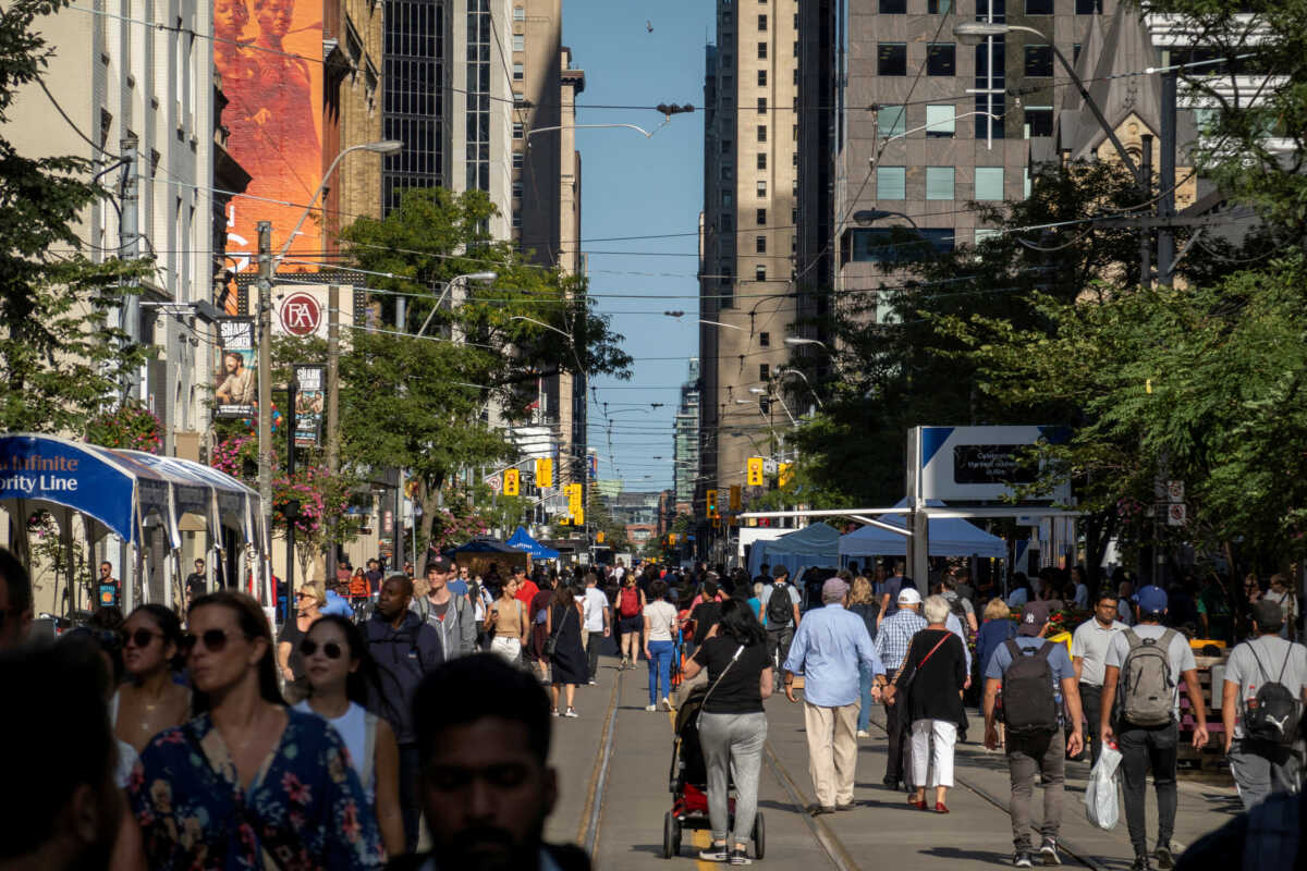 FILE PHOTO: People walk along King Street West in Toronto, Ontario, Canada September 8, 2022. REUTERS