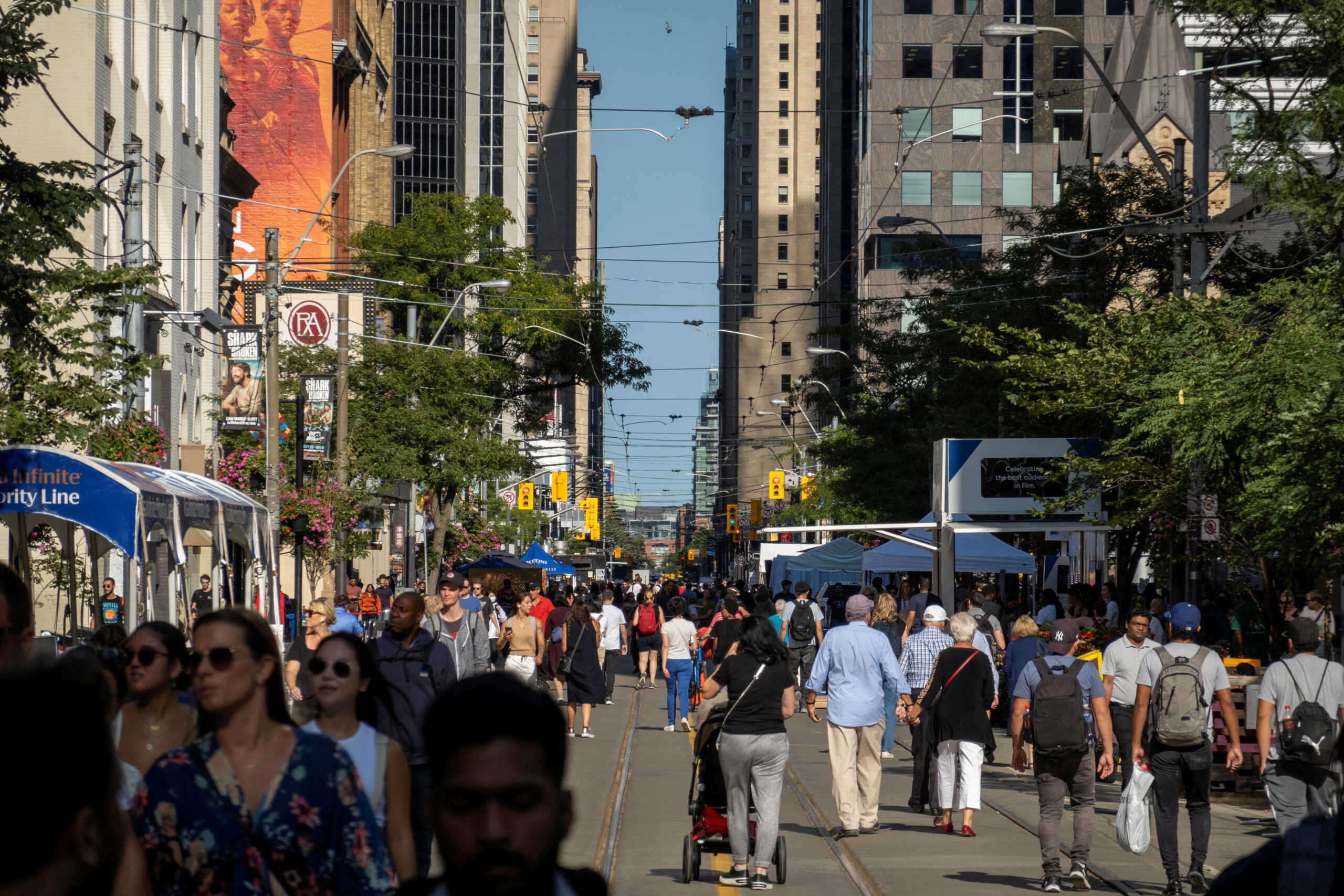 FILE PHOTO: People walk along King Street West in Toronto, Ontario, Canada September 8, 2022. REUTERS