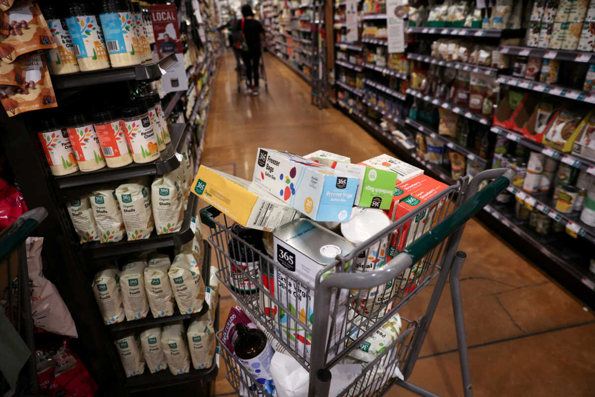 FILE PHOTO: A shopping cart is seen in a supermarket in Manhattan, New York City, U.S., June 10, 2022. REUTERS