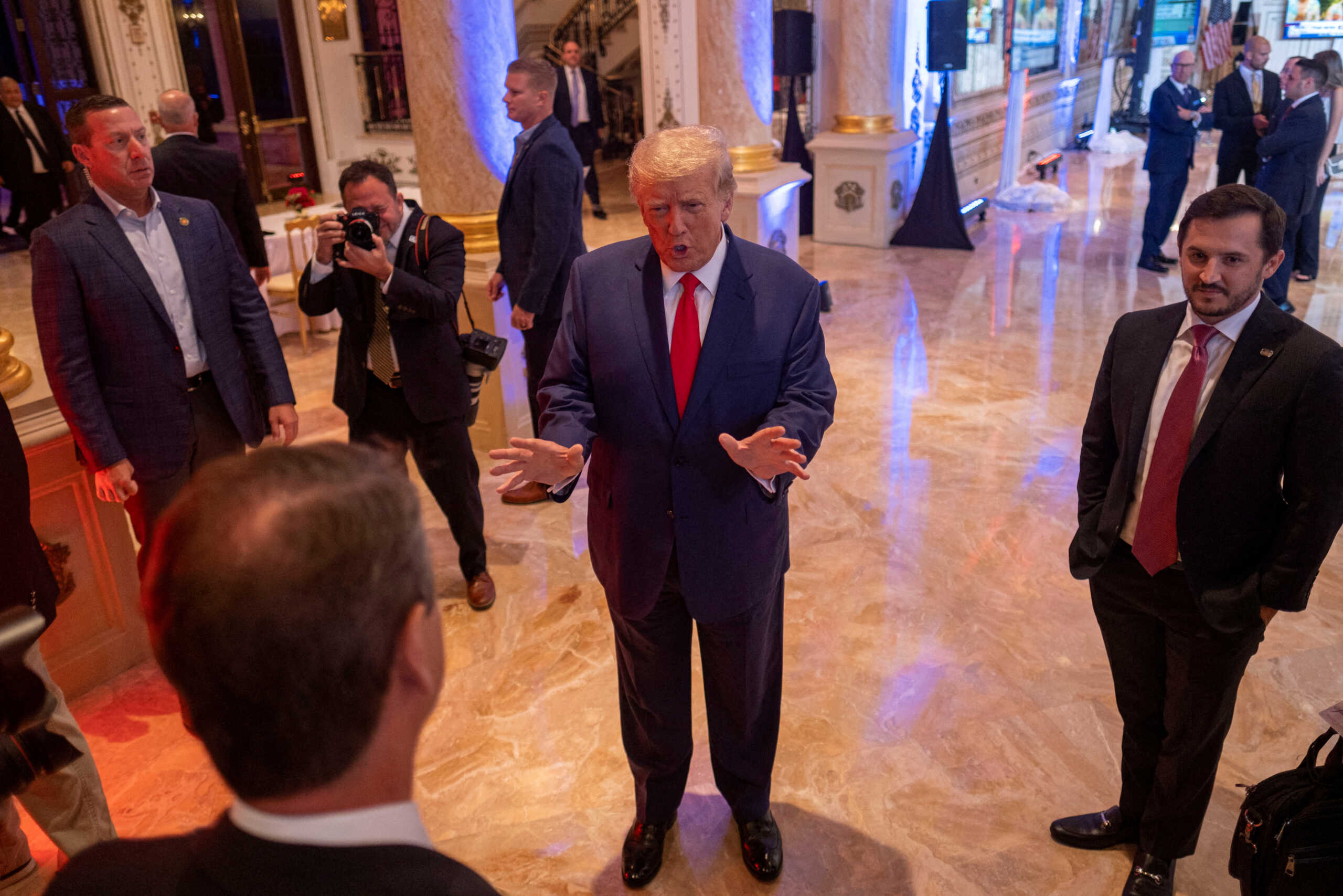 FILE PHOTO: Former U.S. President Donald Trump talks to the press on the grounds of his Mar-a-Lago resort on midterm elections night in Palm Beach, Florida, U.S. November 8, 2022.  REUTERS