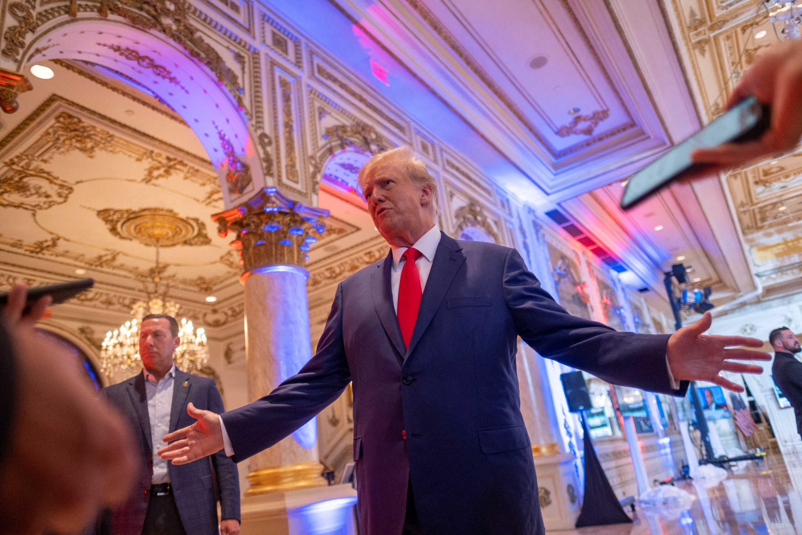 Former U.S. President Donald Trump talks to the press on the grounds of his Mar-a-Lago resort on midterm elections night in Palm Beach, Florida, U.S. November 8, 2022.  REUTERS