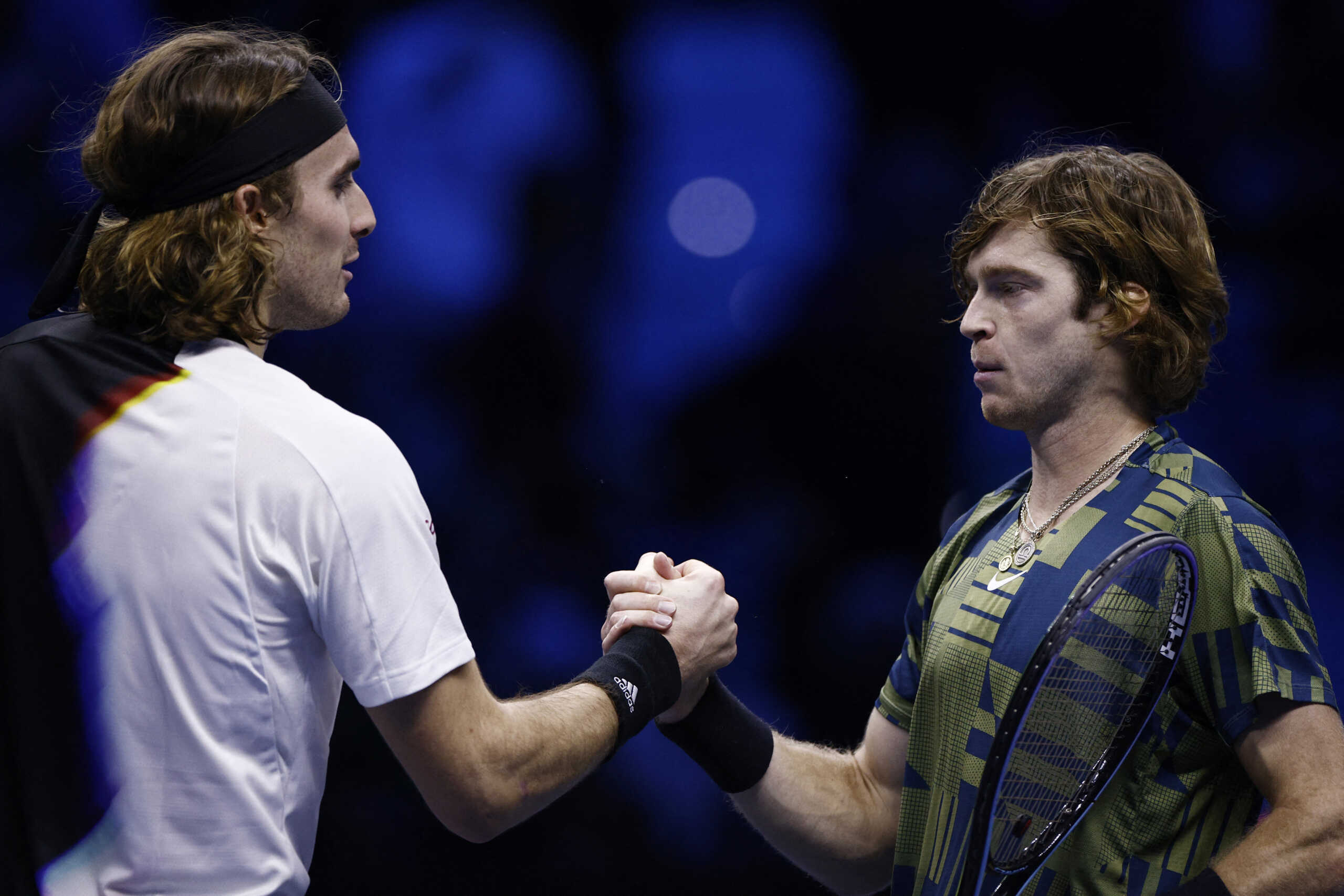 Tennis - ATP Finals Turin - Pala Alpitour, Turin, Italy - November 18, 2022 Russia's Andrey Rublev shakes hands with Greece's Stefanos Tsitsipas after winning their group stage match REUTERS