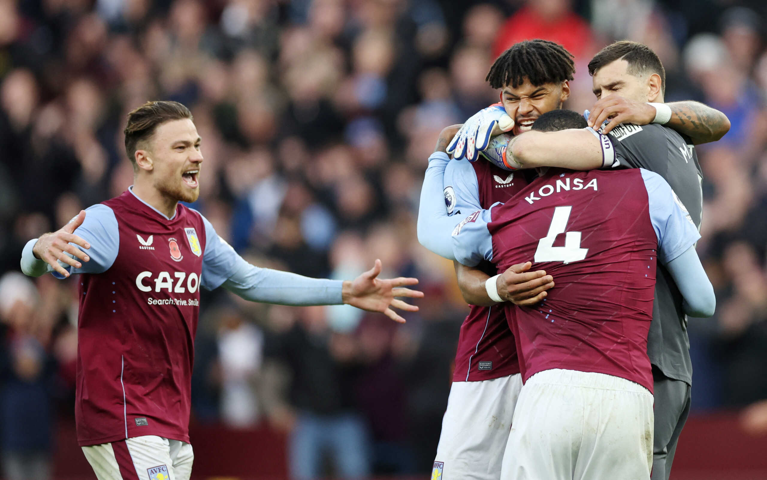 Soccer Football - Premier League - Aston Villa v Manchester United - Villa Park, Birmingham, Britain - November 6, 2022 Aston Villa's Matty Cash, Ezri Konsa, Tyrone Mings and Emiliano Martinez celebrate after the match REUTERS