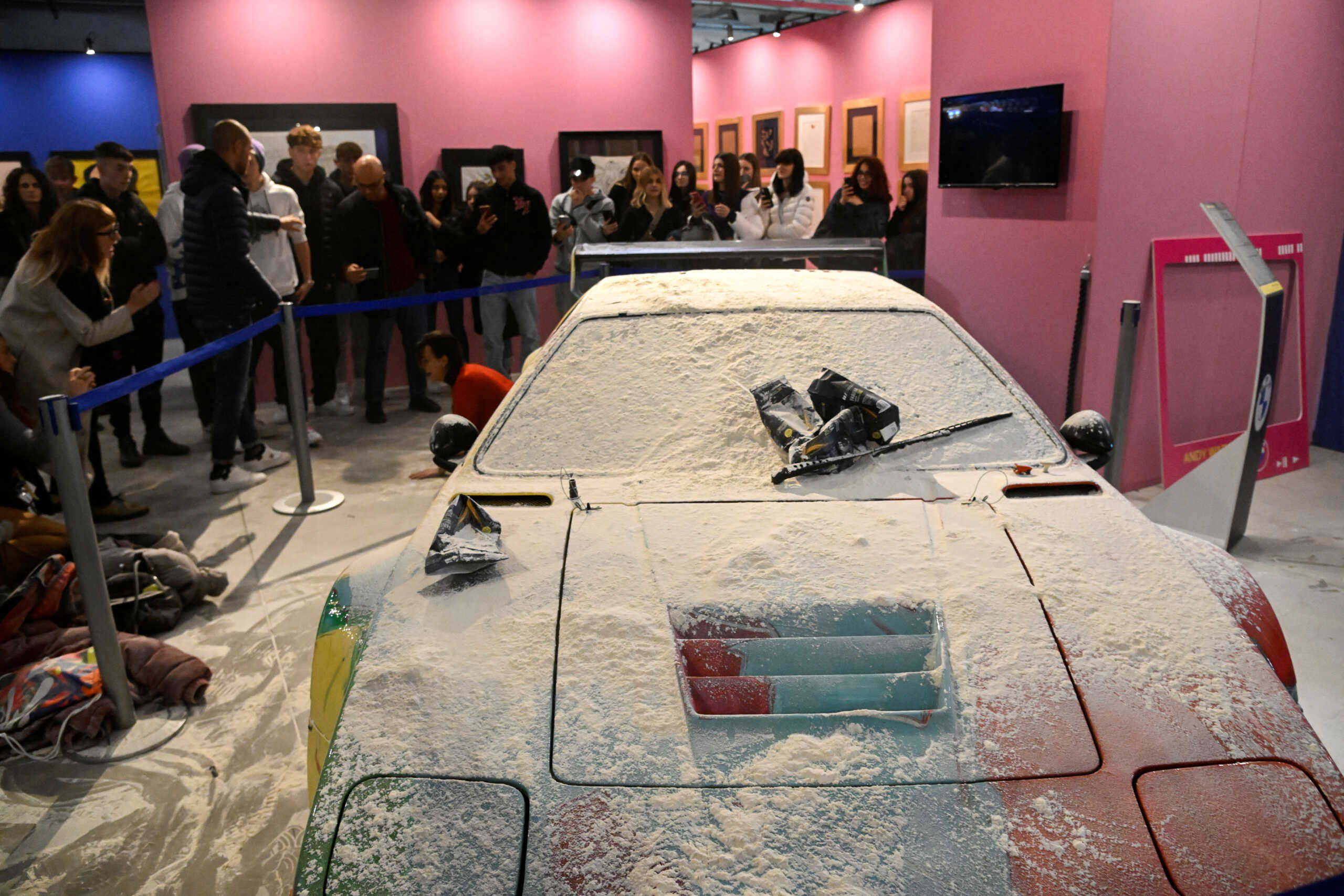 An exibit is covered in flour after climate activists of ''Ultima Generazione (Last Generation)" threw it at Andy Warhol's exhibition, in Milan, Italy, November 18, 2022. REUTERS