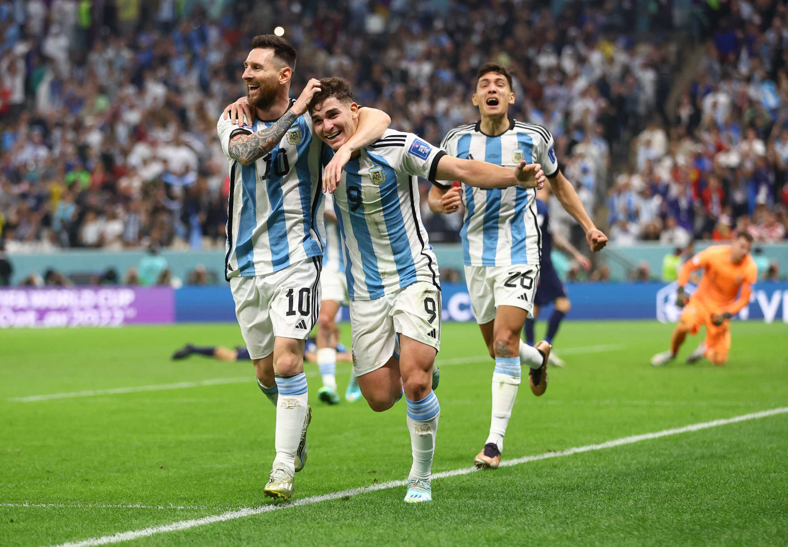 Soccer Football - FIFA World Cup Qatar 2022 - Semi Final - Argentina v Croatia - Lusail Stadium, Lusail, Qatar - December 13, 2022 Argentina's Julian Alvarez celebrates scoring their second goal with Lionel Messi and Nahuel Molina REUTERS