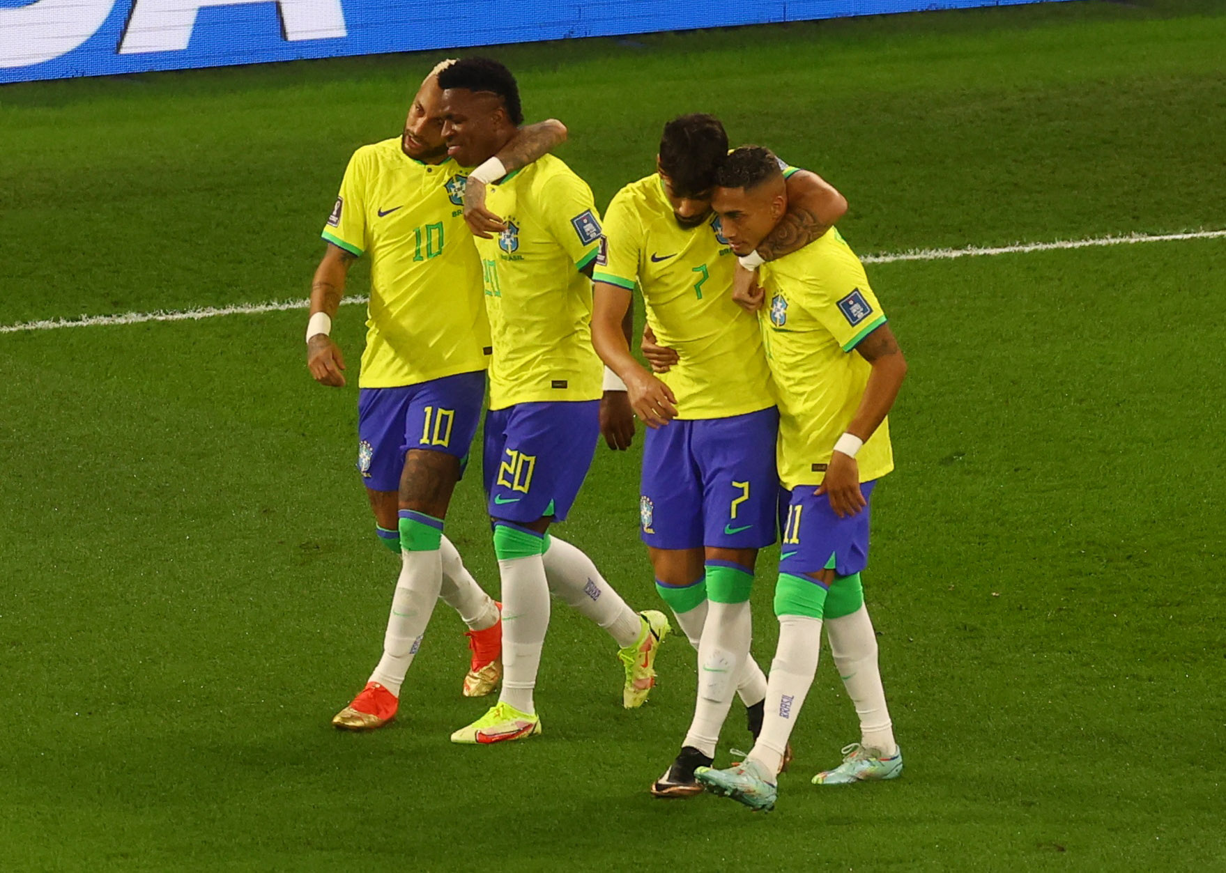 Soccer Football - FIFA World Cup Qatar 2022 - Round of 16 - Brazil v South Korea - Stadium 974, Doha, Qatar - December 5, 2022 Brazil's Vinicius Junior celebrates scoring their first goal with teammates REUTERS