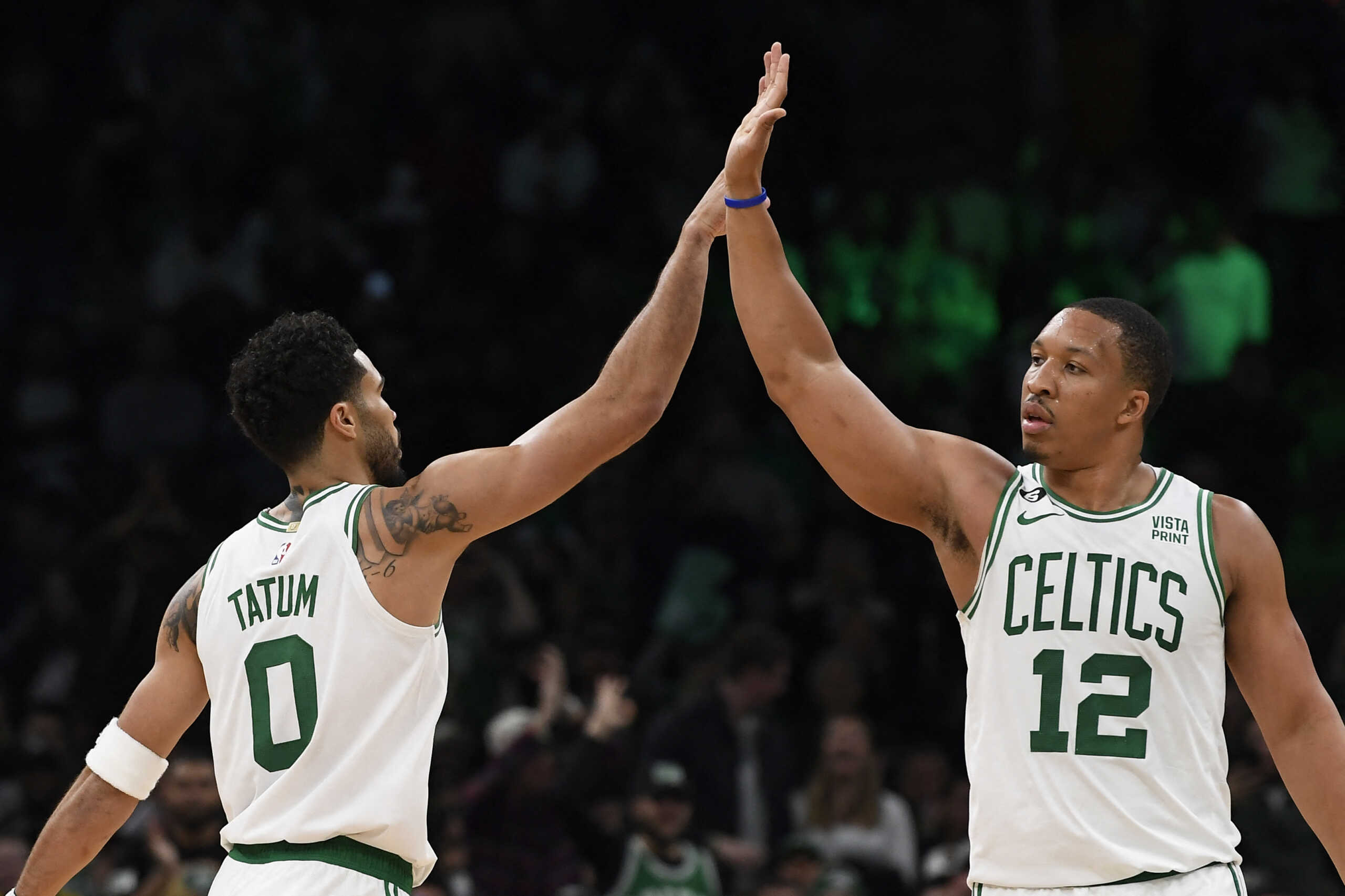 Nov 9, 2022; Boston, Massachusetts, USA; Boston Celtics forward Grant Williams (12) high fives forward Jayson Tatum (0) during the second half against the Detroit Pistons at TD Garden. Mandatory Credit: Bob DeChiara-USA TODAY Sports