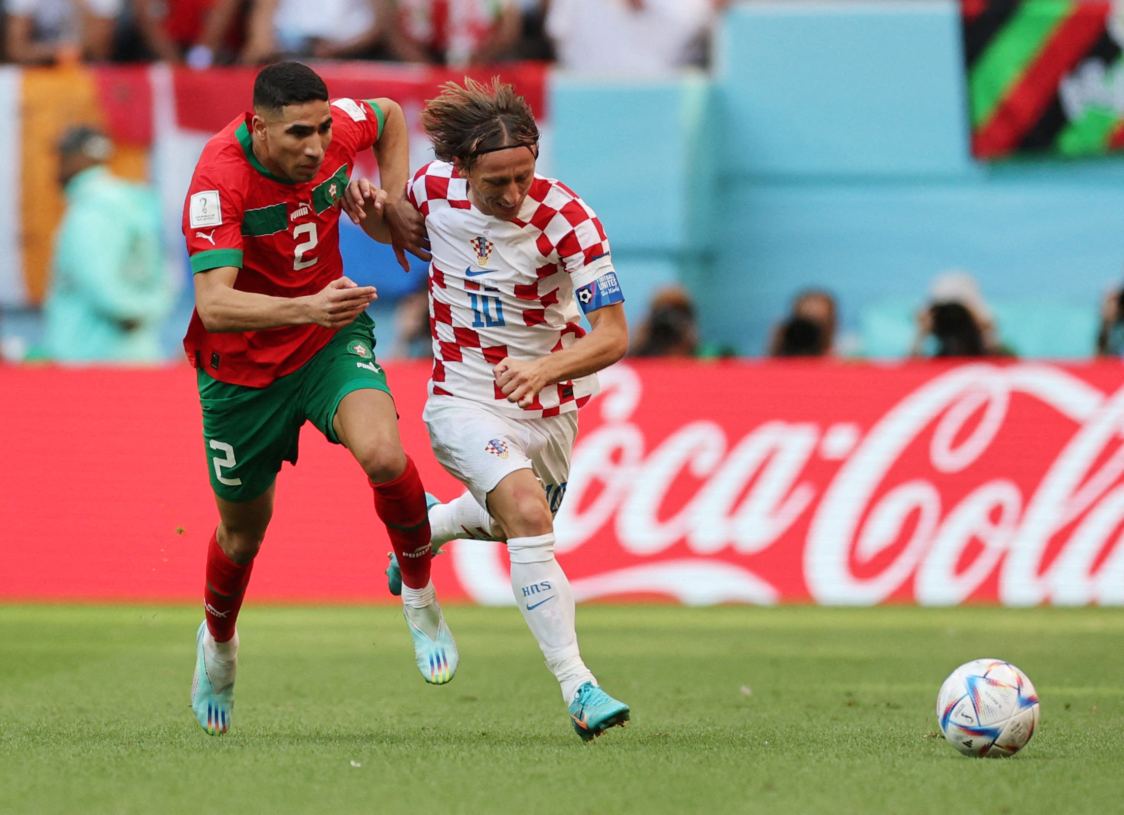 Soccer Football - FIFA World Cup Qatar 2022 - Group F - Morocco v Croatia - Al Bayt Stadium, Al Khor, Qatar - November 23, 2022 Croatia's Luka Modric in action with Morocco's Achraf Hakimi REUTERS