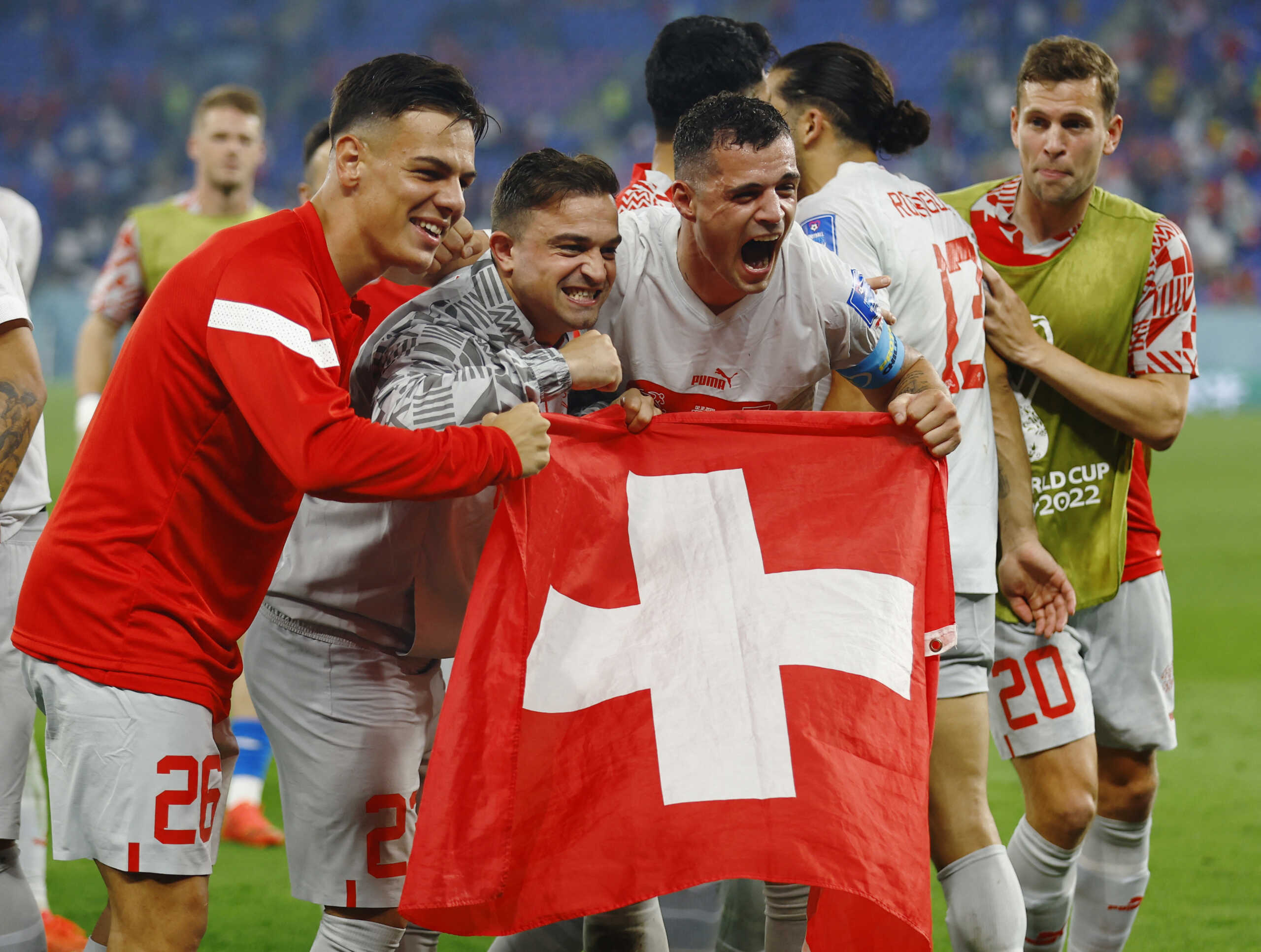 Soccer Football - FIFA World Cup Qatar 2022 - Group G - Serbia v Switzerland - Stadium 974, Doha, Qatar - December 3, 2022 Switzerland's Granit Xhaka and teammates celebrate qualifying for the knockout stages REUTERS