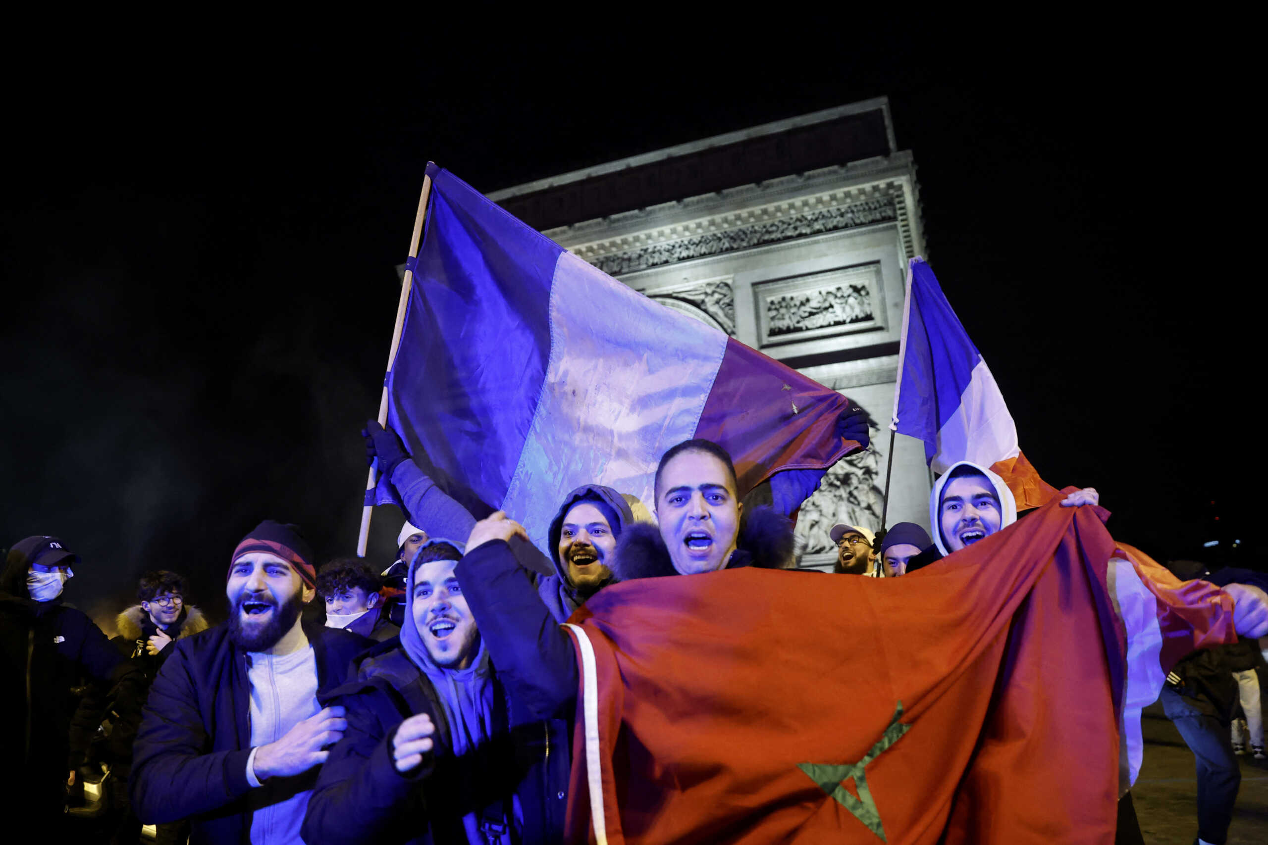 Soccer Football - FIFA World Cup Qatar 2022 - Fans gather in Paris for Morocco v Portugal - Paris, France - December 10, 2022 Morocco fans celebrate  after the match as Morocco progress to the semi finals REUTERS