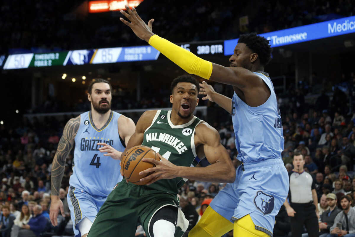 Dec 15, 2022; Memphis, Tennessee, USA; Milwaukee Bucks forward Giannis Antetokounmpo (34) drives to the basket as Memphis Grizzlies forward Jaren Jackson Jr. (13) defends during the second half at FedExForum. Mandatory Credit: Petre Thomas-USA TODAY Sports