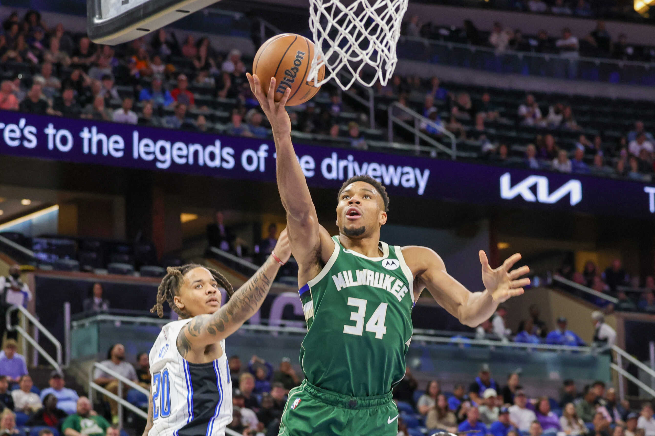 Dec 5, 2022; Orlando, Florida, USA; Milwaukee Bucks forward Giannis Antetokounmpo (34) goes to the basket against Orlando Magic guard Markelle Fultz (20) during the second half at Amway Center. Mandatory Credit: Mike Watters-USA TODAY Sports