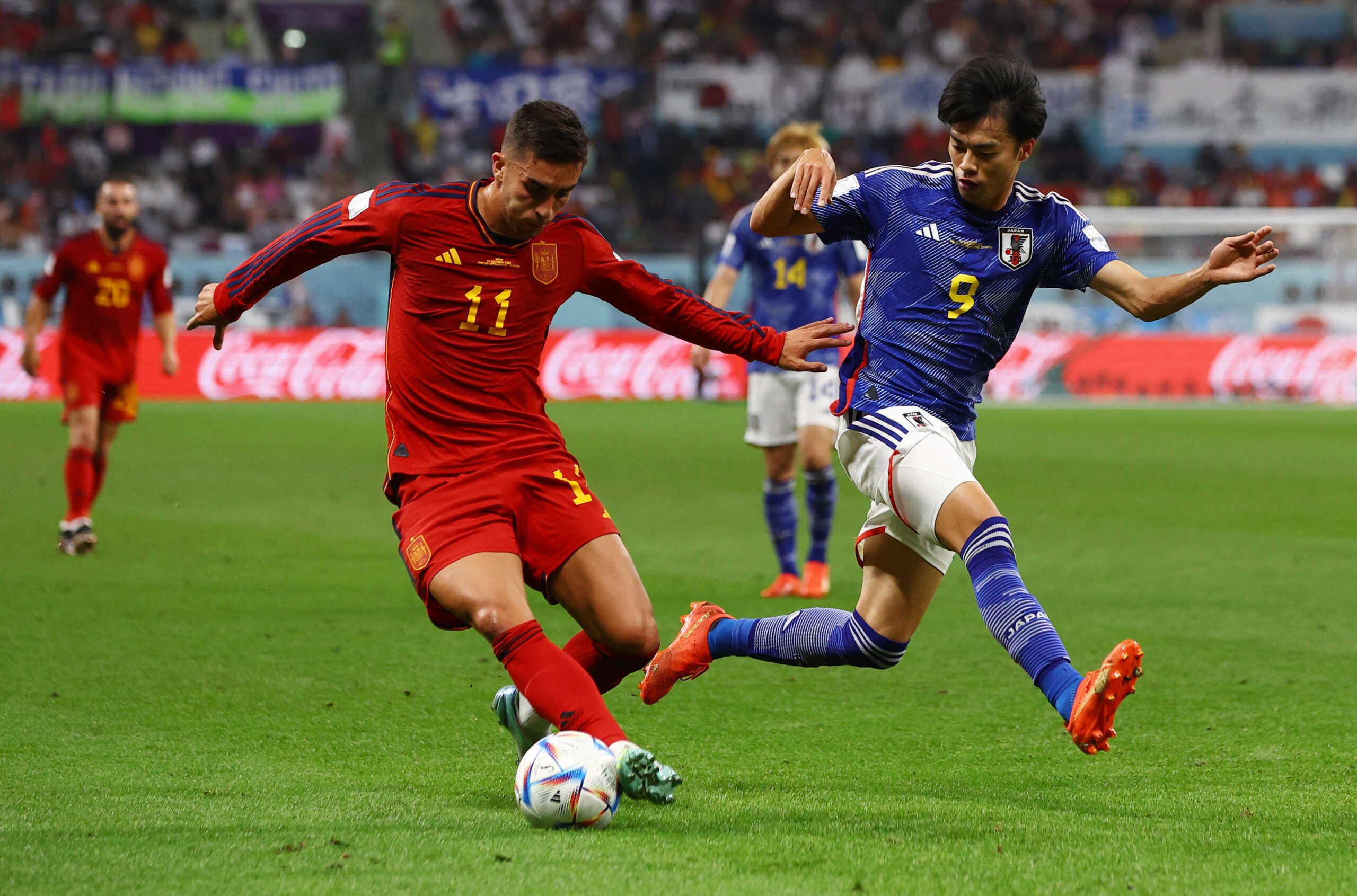 Soccer Football - FIFA World Cup Qatar 2022 - Group E - Japan v Spain - Khalifa International Stadium, Doha, Qatar - December 1, 2022  Spain's Ferran Torres in action with Japan's Kaoru Mitoma REUTERS