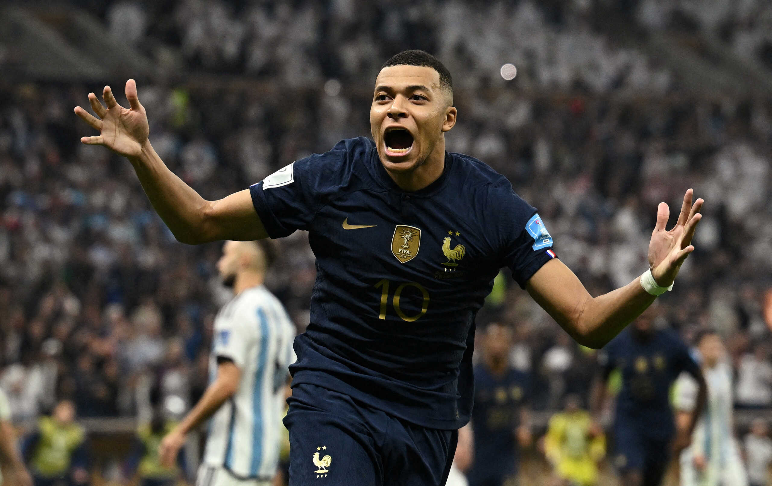 Soccer Football - FIFA World Cup Qatar 2022 - Final - Argentina v France - Lusail Stadium, Lusail, Qatar - December 18, 2022  France's Kylian Mbappe celebrates scoring their third goal to complete his hat-trick REUTERS