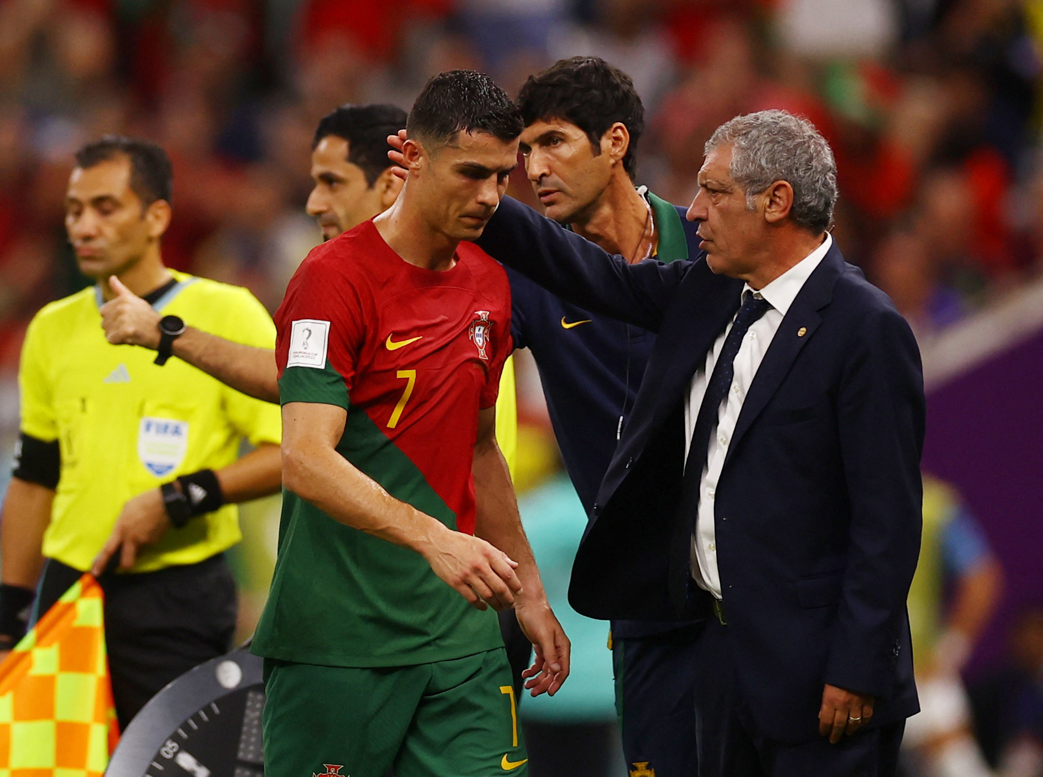 Soccer Football - FIFA World Cup Qatar 2022 - Group H - Portugal v Uruguay - Lusail Stadium, Lusail, Qatar - November 28, 2022  Portugal's Cristiano Ronaldo with coach Fernando Santos after being substituted REUTERS