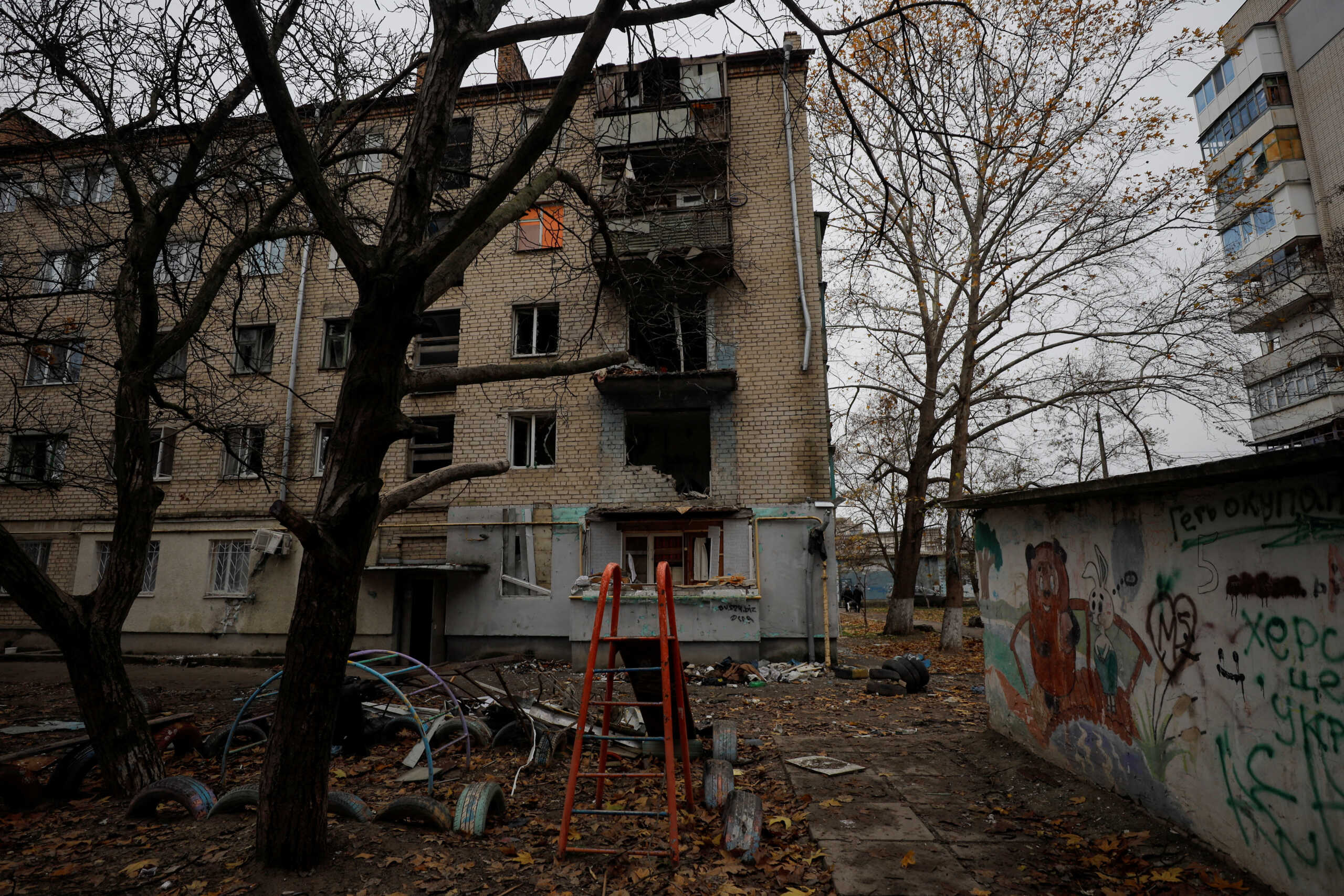 FILE PHOTO: A view shows an apartment building damaged by a recent Russian military strike in Kherson, Ukraine November 27, 2022.  REUTERS