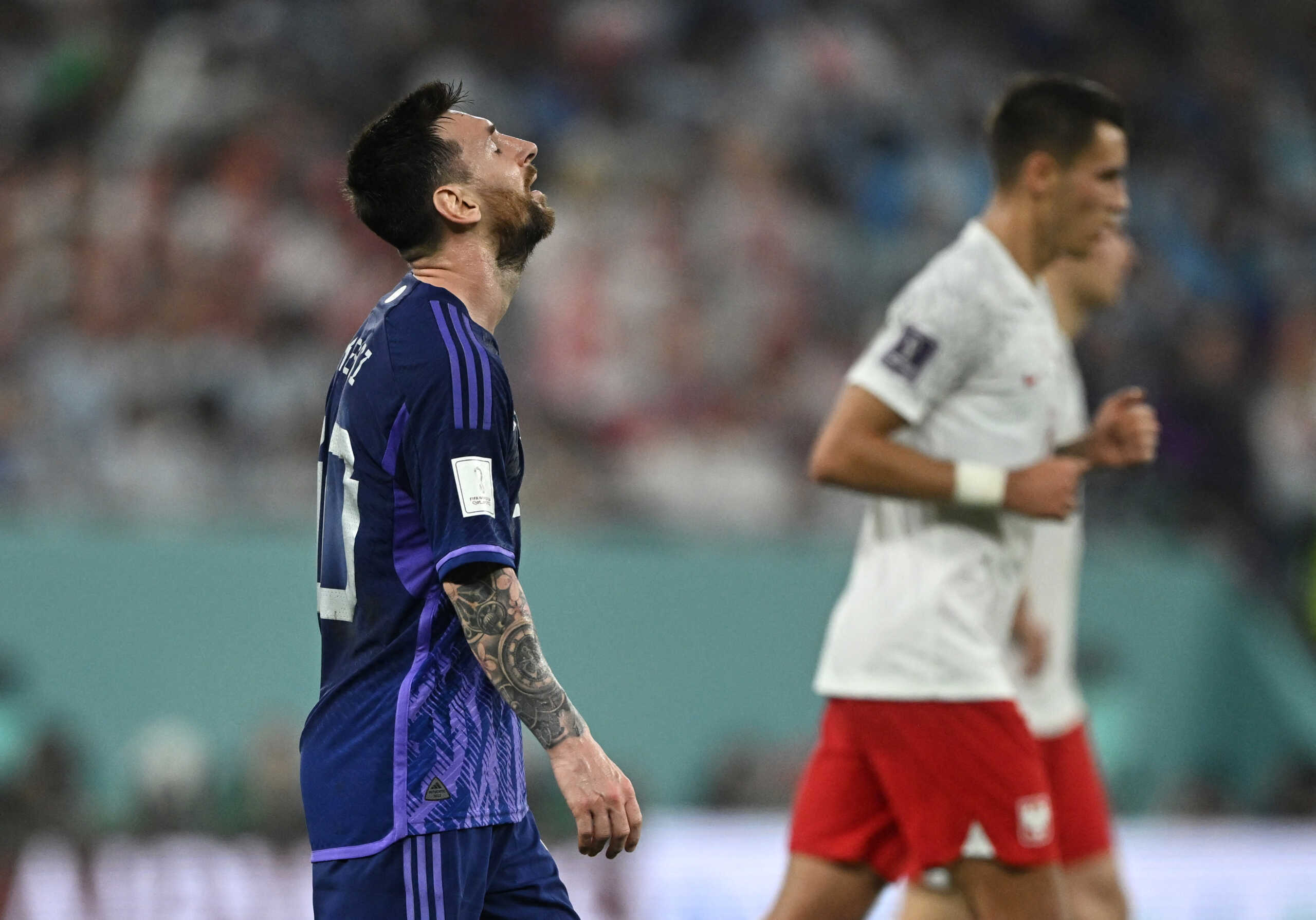 Soccer Football - FIFA World Cup Qatar 2022 - Group C - Poland v Argentina - Stadium 974, Doha, Qatar - November 30, 2022 Argentina's Lionel Messi reacts REUTERS