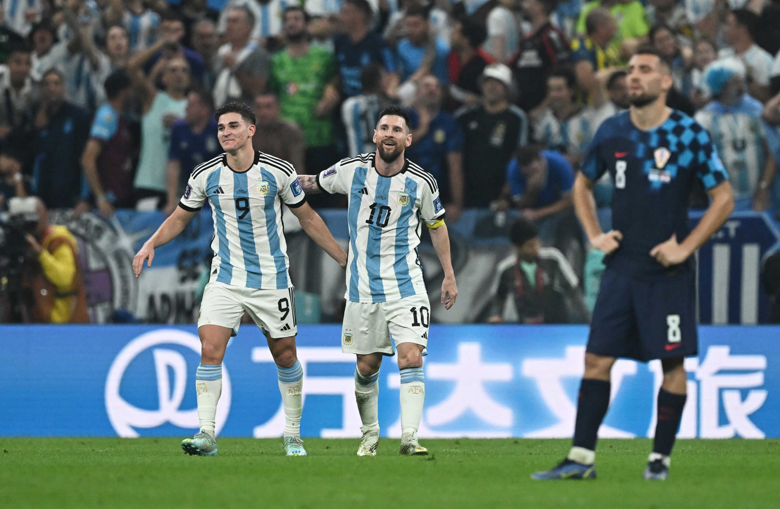 Soccer Football - FIFA World Cup Qatar 2022 - Semi Final - Argentina v Croatia - Lusail Stadium, Lusail, Qatar - December 13, 2022 Argentina's Julian Alvarez celebrates scoring their third goal with Lionel Messi REUTERS