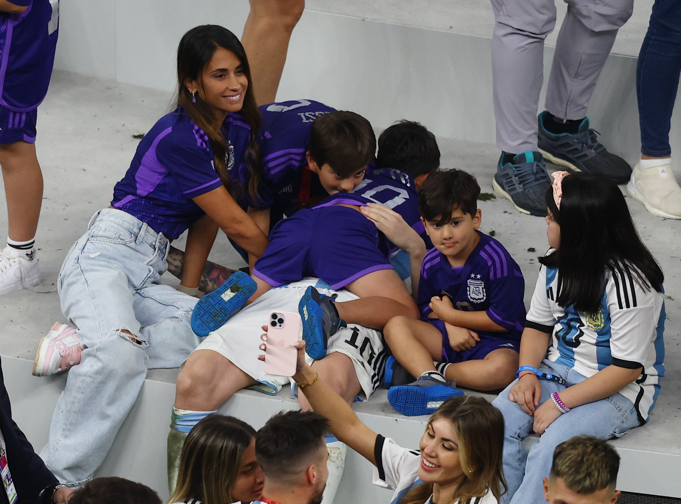 Soccer Football - FIFA World Cup Qatar 2022 - Final - Argentina v France - Lusail Stadium, Lusail, Qatar - December 18, 2022 Argentina's Lionel Messi celebrates with his wife Antonela Roccuzzo and sons Ciro, Mateo and Thiago after winning the World Cup REUTERS