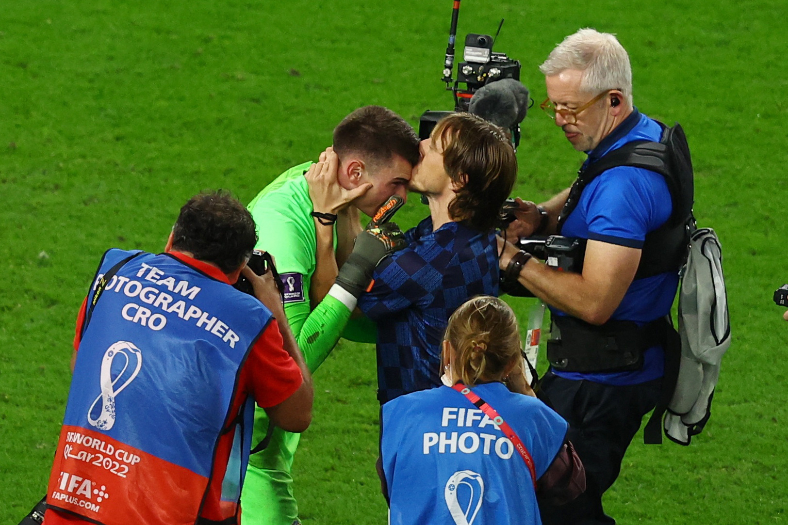 Soccer Football - FIFA World Cup Qatar 2022 - Round of 16 - Japan v Croatia - Al Janoub Stadium, Al Wakrah, Qatar - December 5, 2022 Croatia's Dominik Livakovic celebrates with Luka Modric after winning the penalty shootout and progressing to the quarter finals REUTERS